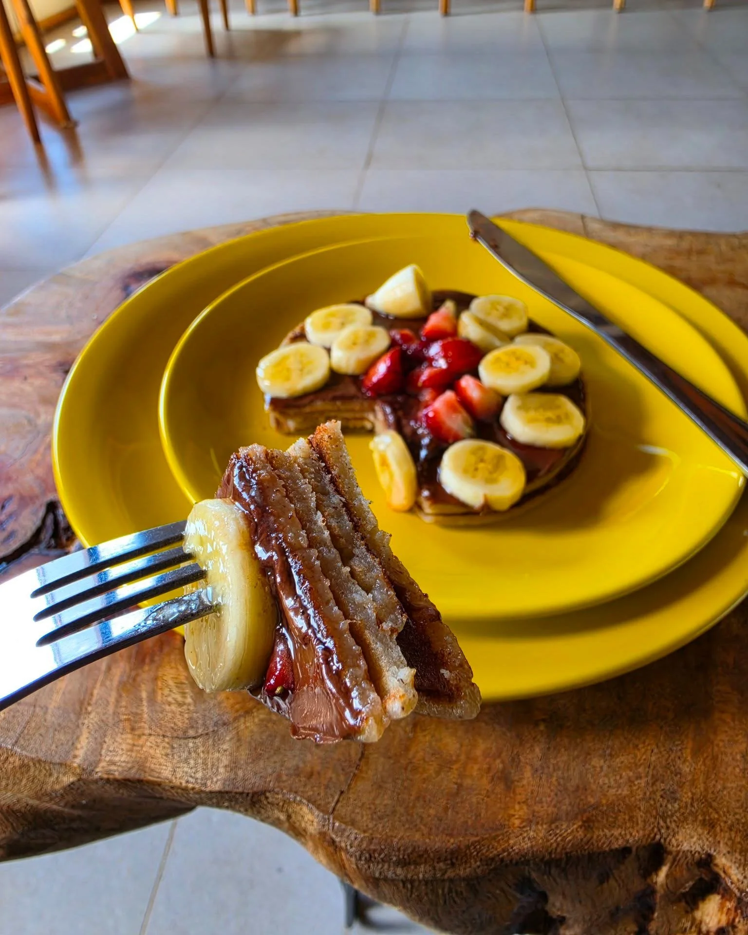 The perfect bite doesn't exi&mdash; 🍴✨

Fluffy stacked layers, a rich ribbon of chocolate spread, fresh strawberries, and sweet banana slices on top. Every single forkful at Pure Tropics hits the spot. 🤤

Who are you bringing for breakfast this wee