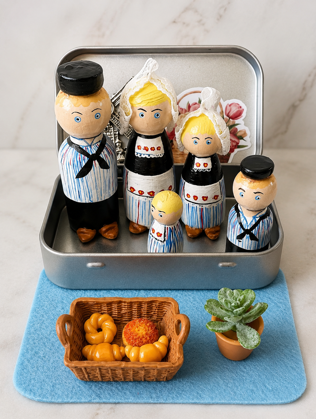 Dutch Peg Dolls in a tin