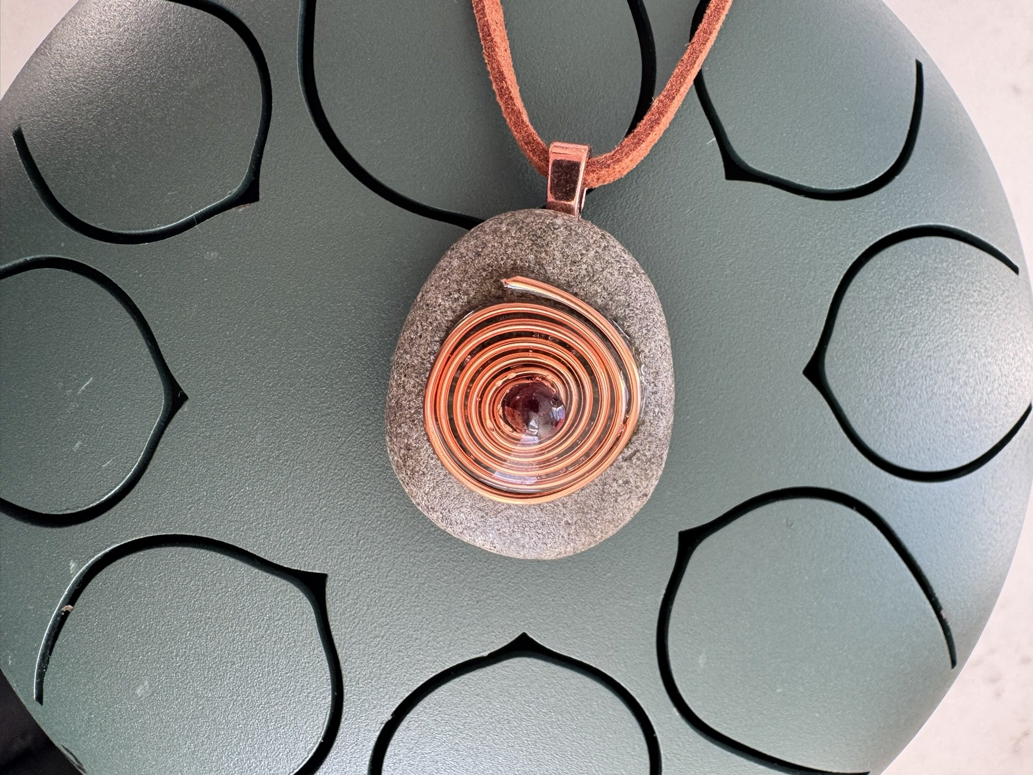 Beach Stone Pendant – Copper Spiral & Garnet