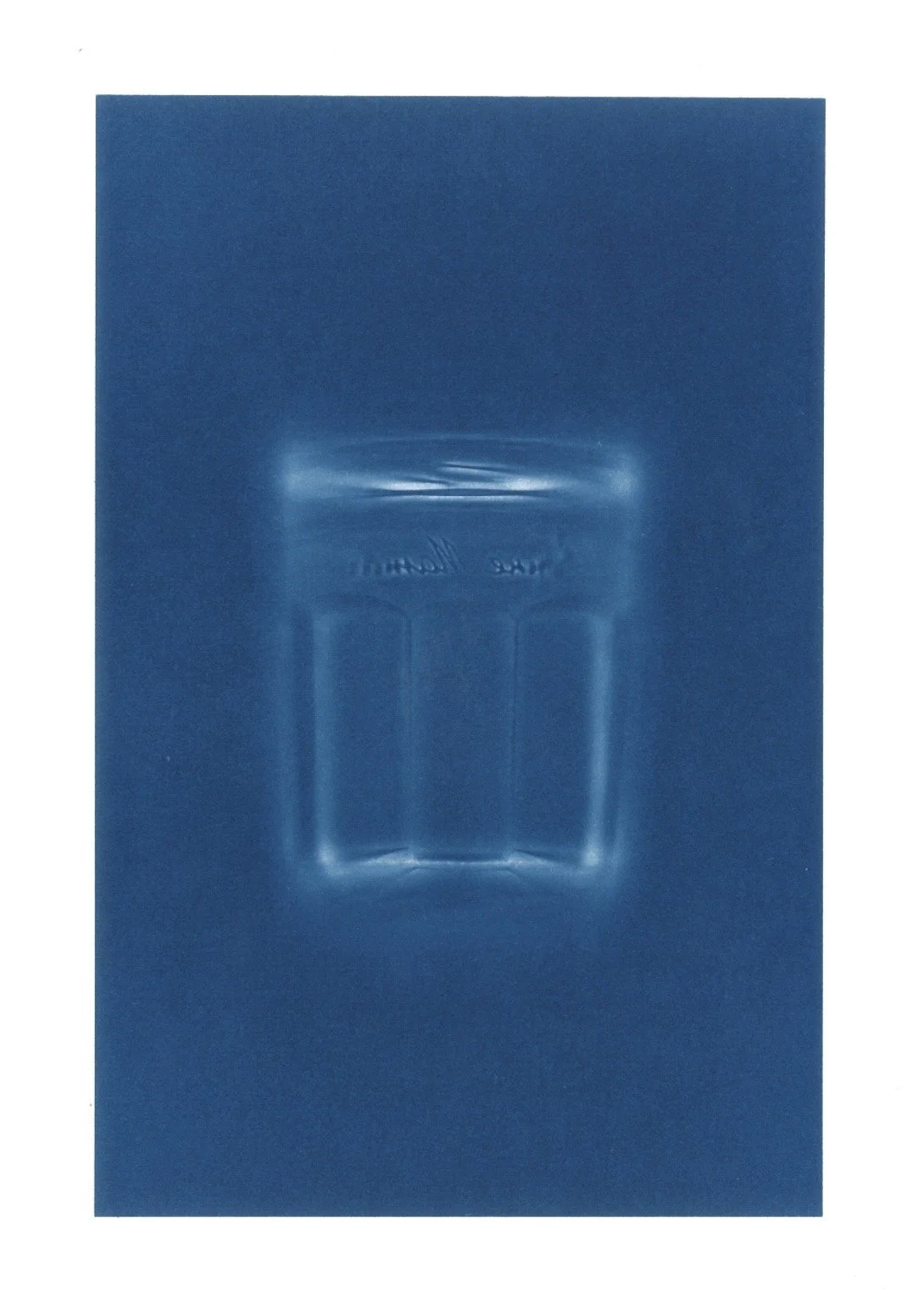 Blue Styrofoam mold with a rectangular cavity and raised edges.