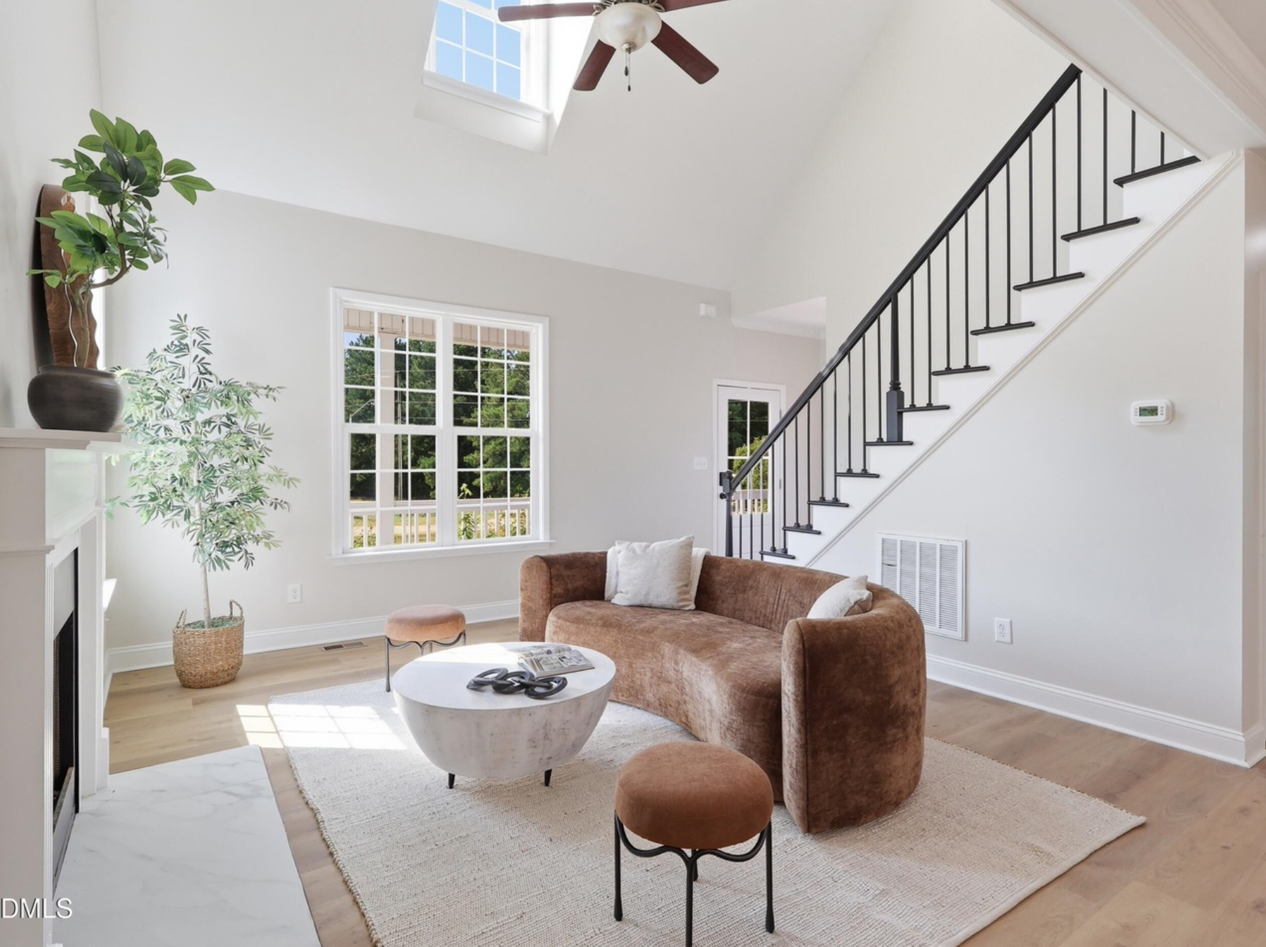 Announcement for a new staging project at Chapel Hill Staging Co., featuring a cozy and elegant living room with beige sofa, armchairs, large windows, and decorative plants, with the text 'Coming Soon' and details about the project.