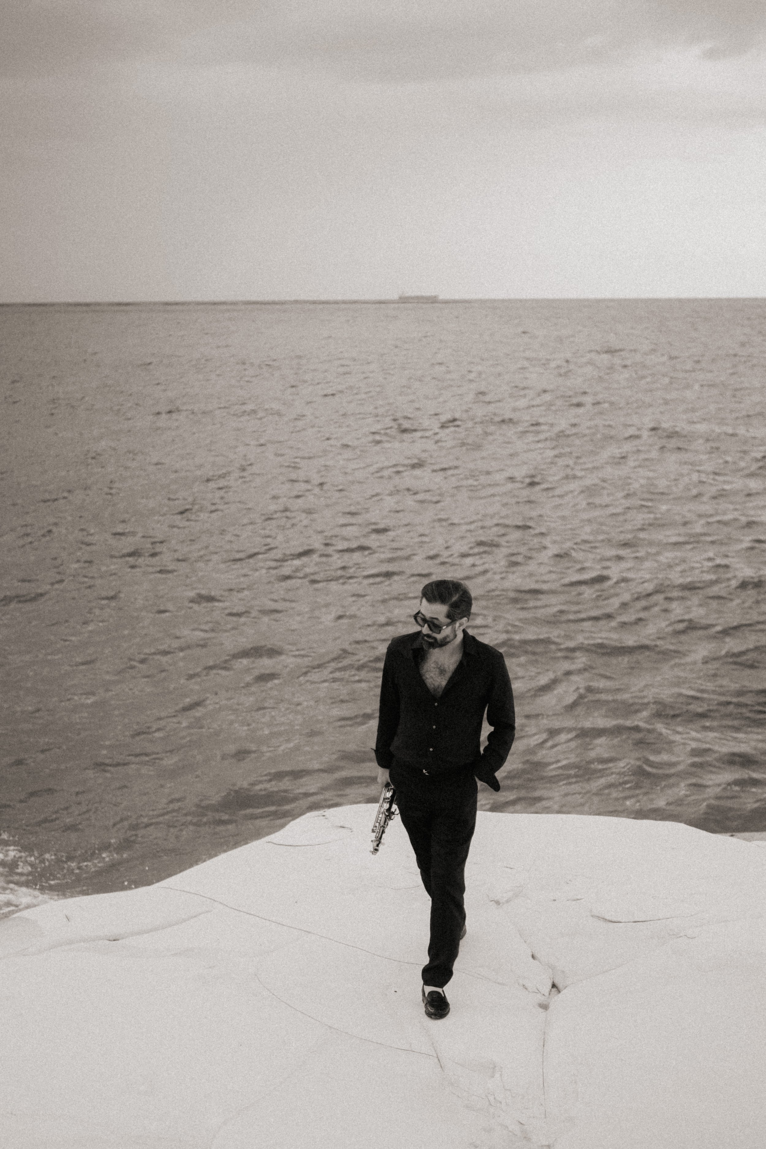 Minimal luxury aesthetic with live saxophone.