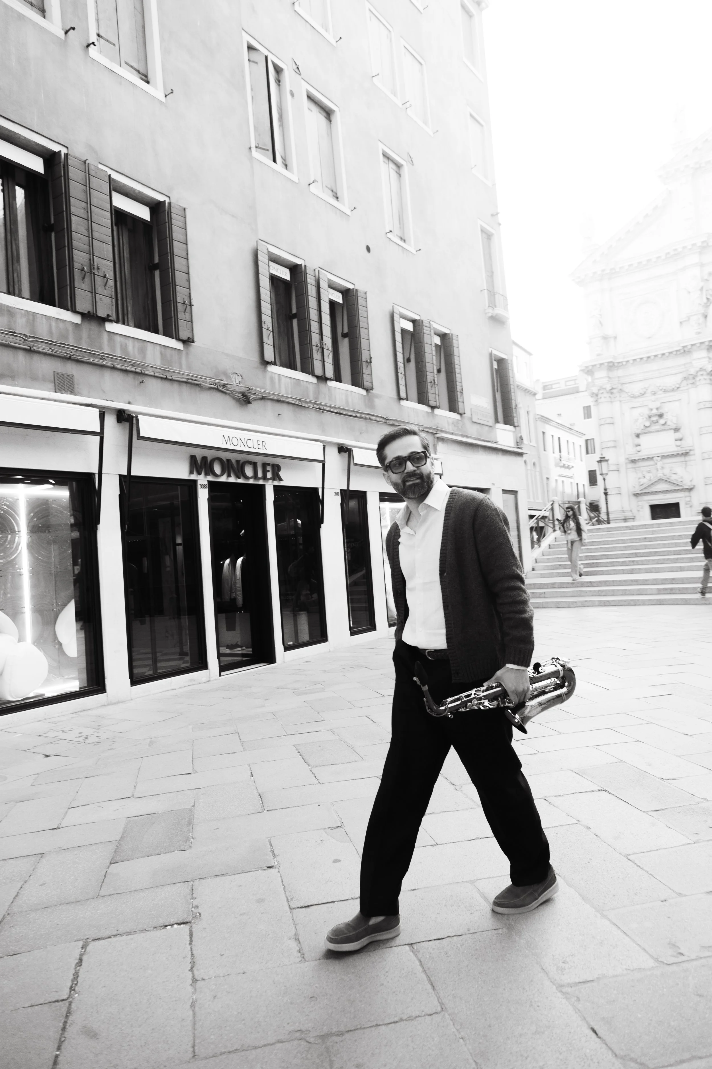 Walking through Venice with the saxophone.