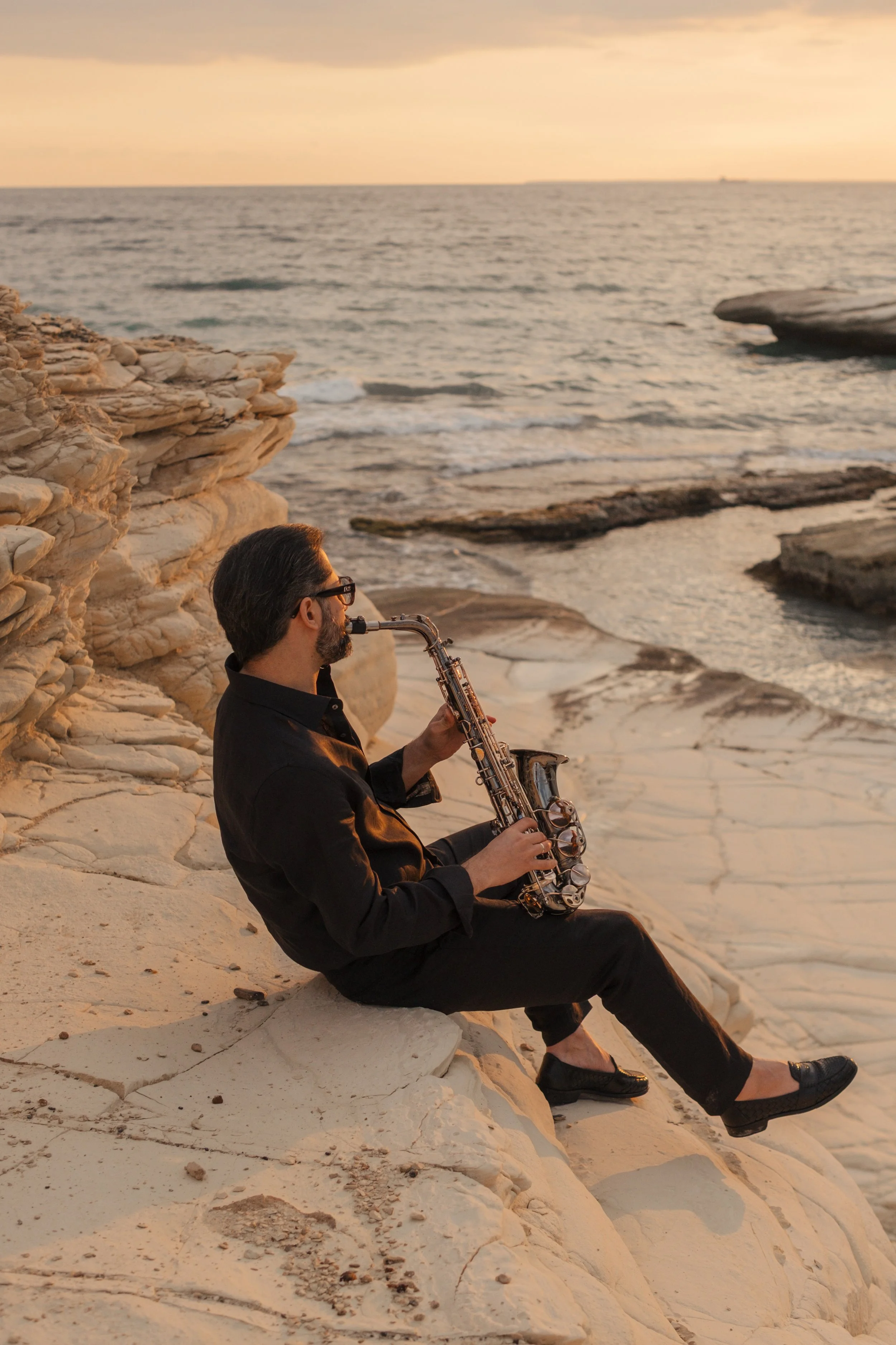 Sunset saxophone session by the sea.