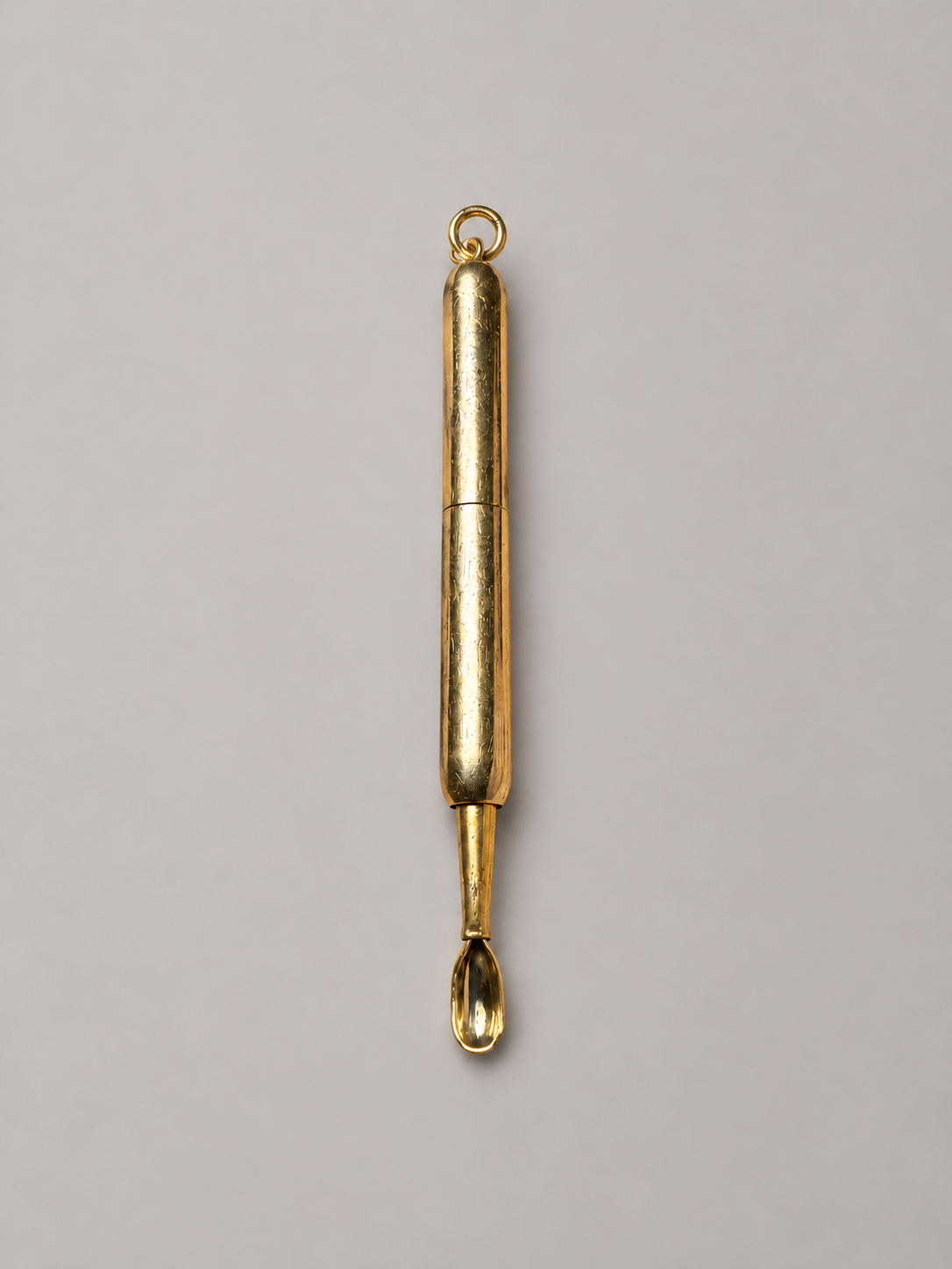 CARTIER RETRACTABLE GOLD SPOON, CIRCA 1940