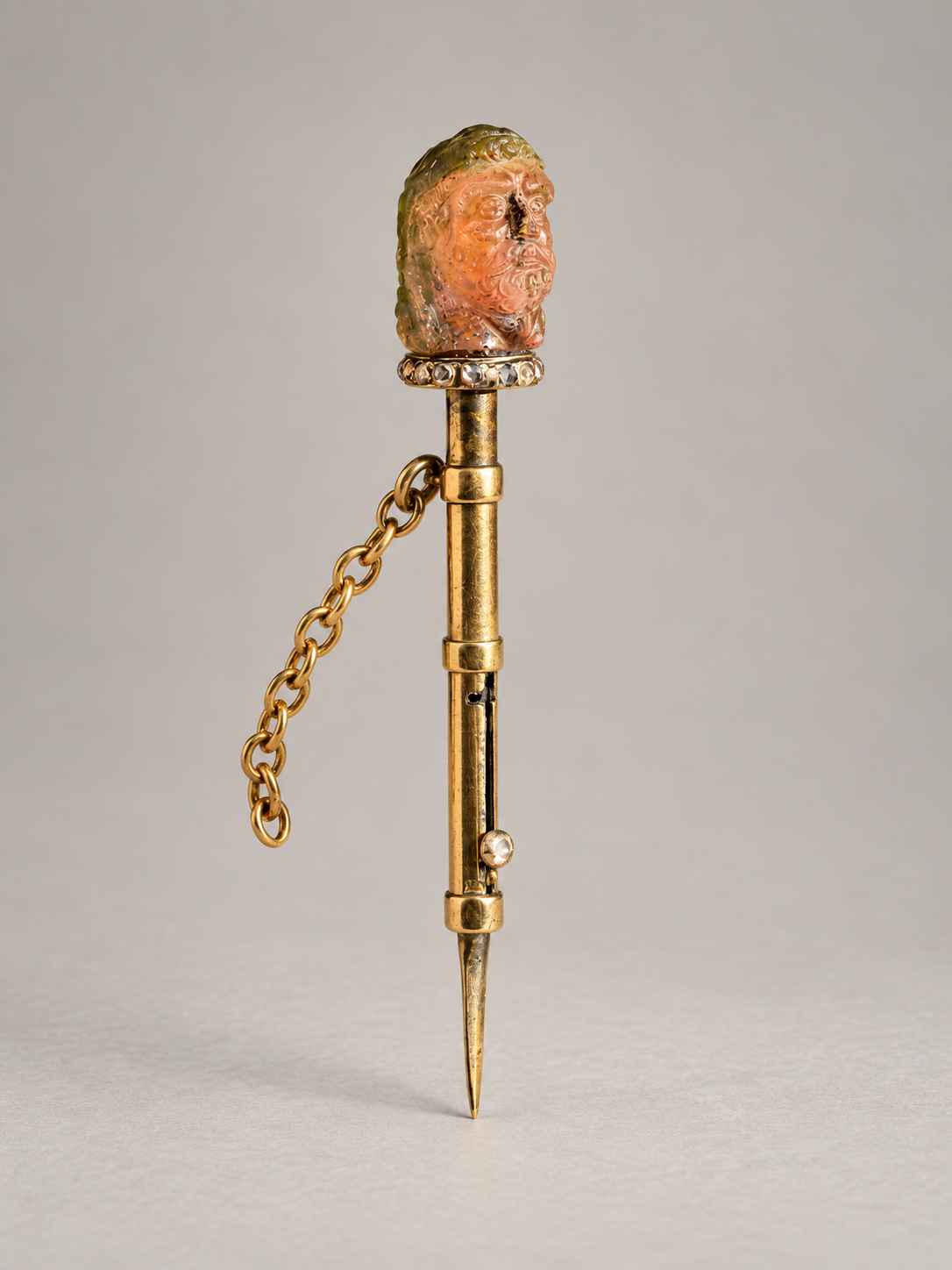 TOURMALINE CARVING OF HERCULES ON GOLD TOOTHPICK 