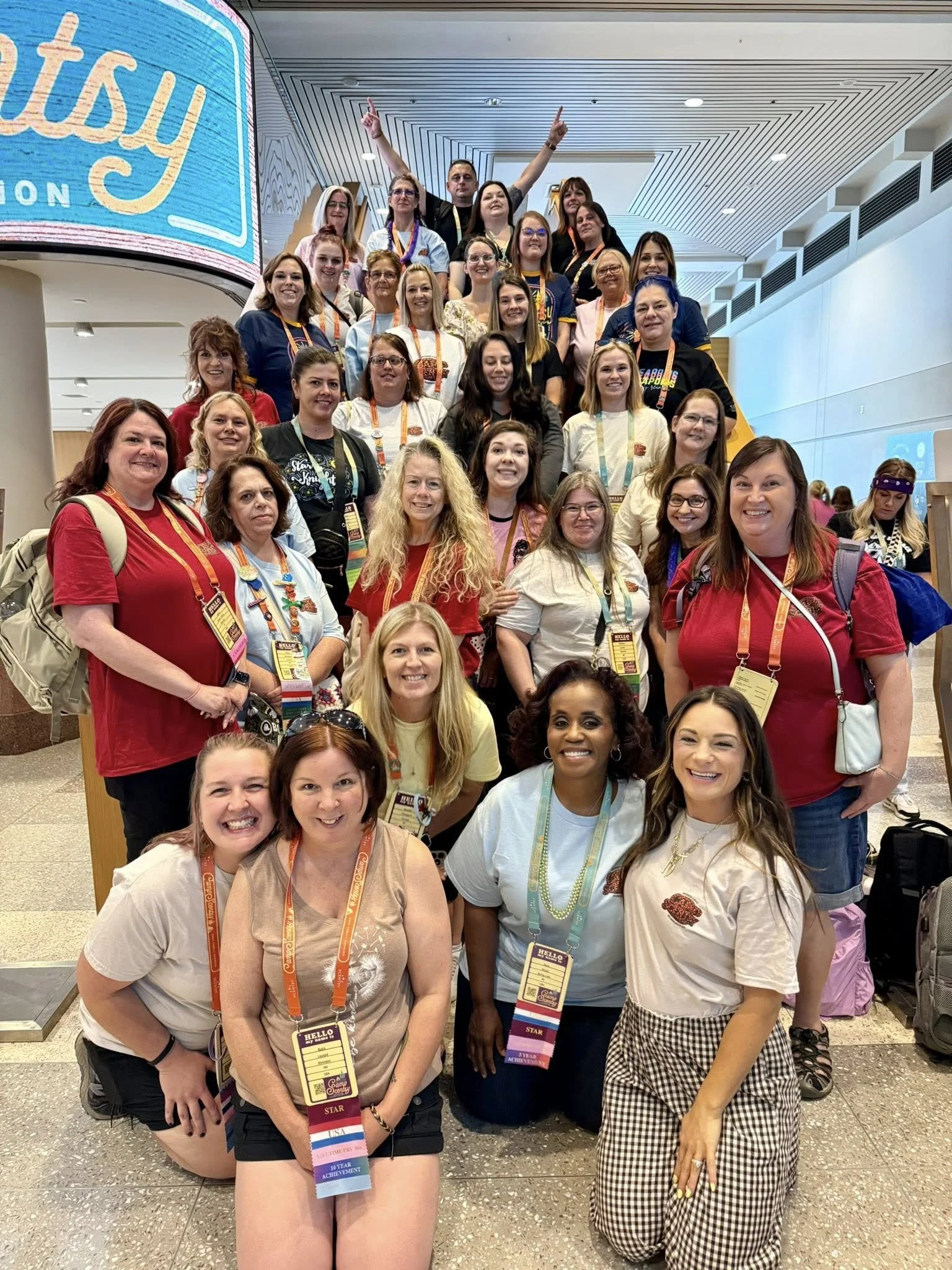 A team photo with a large group of men and women at the end of Scentsy Family Reunion 2025.