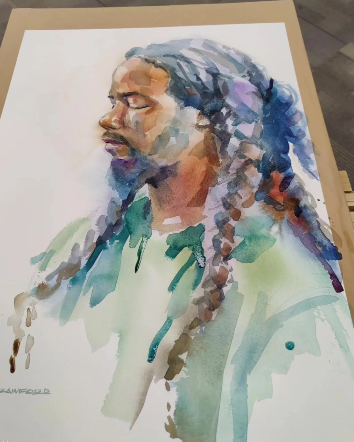 Watercolor painting of a woman with long braided hair, eyes closed, wearing a green top.