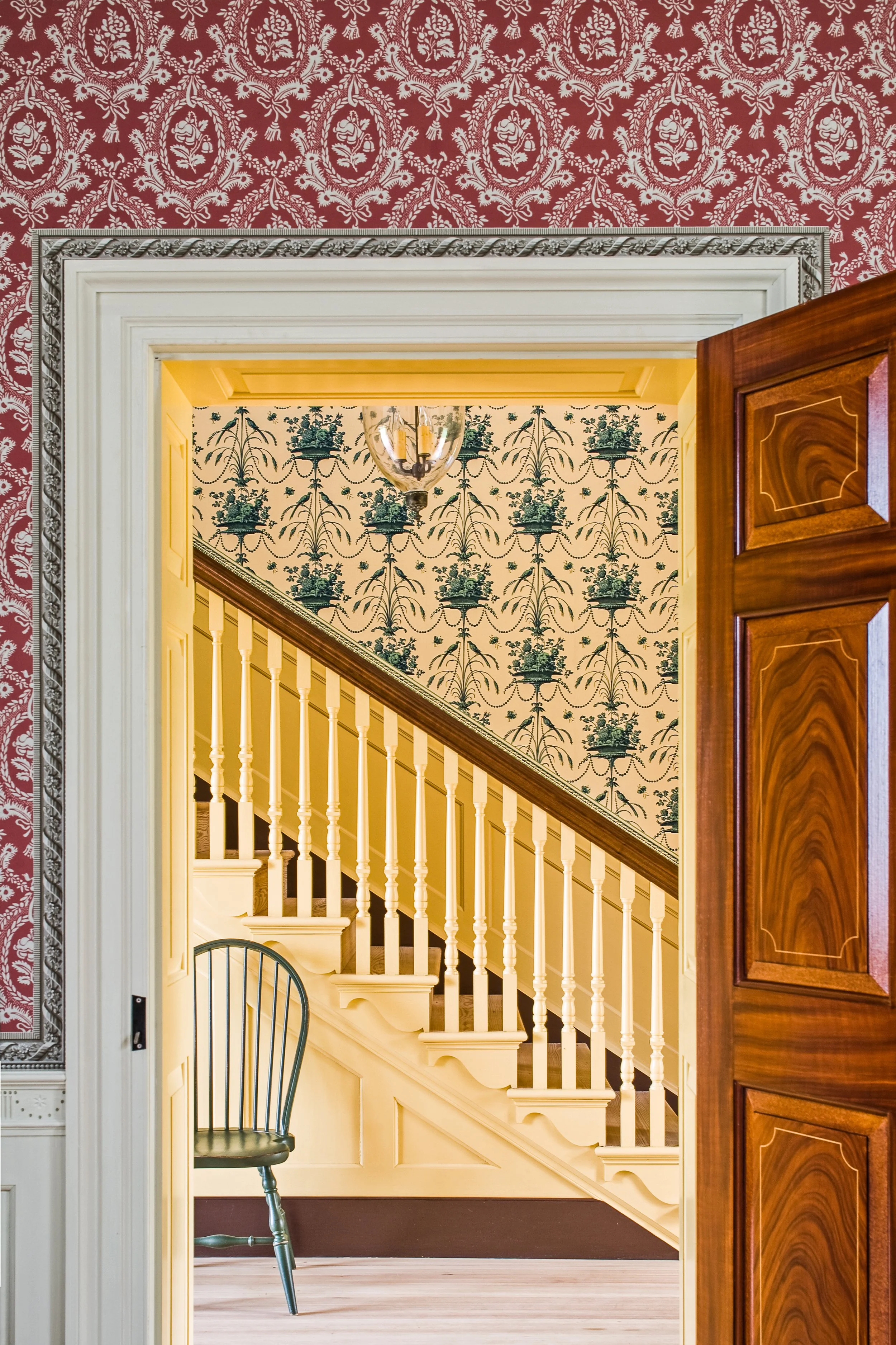 Réveillon Damask with the Réveillon Border in the foreground, Parakeets and Pearls beyond the doorway. © Erik Kvalsvik