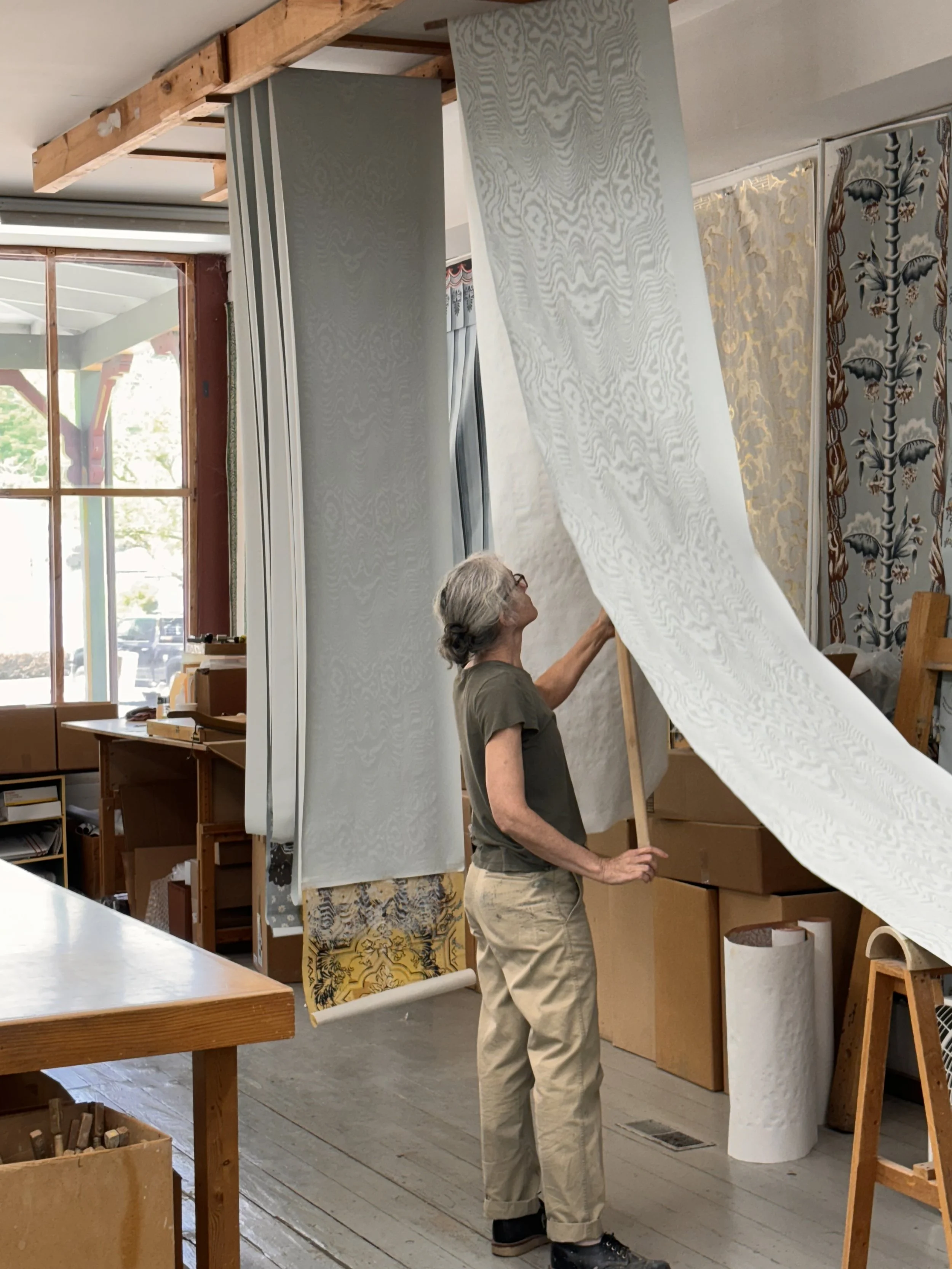 A roll of paper being festooned to dry at the Adelphi Paper Hangings studio. © Jessica Marx