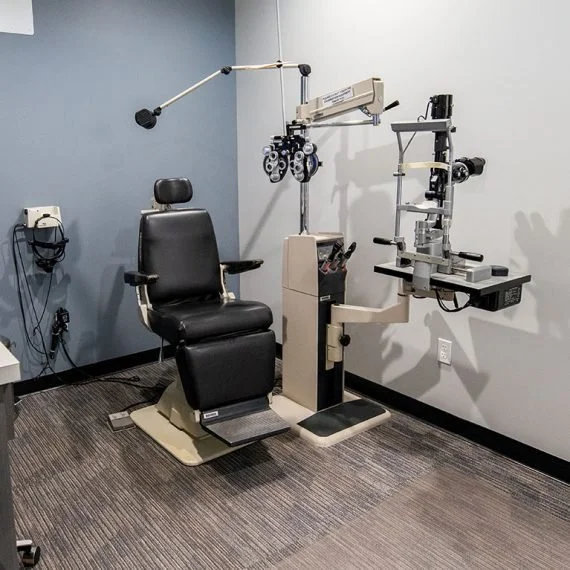 Medical examination chair and equipment in an eye doctor's office.