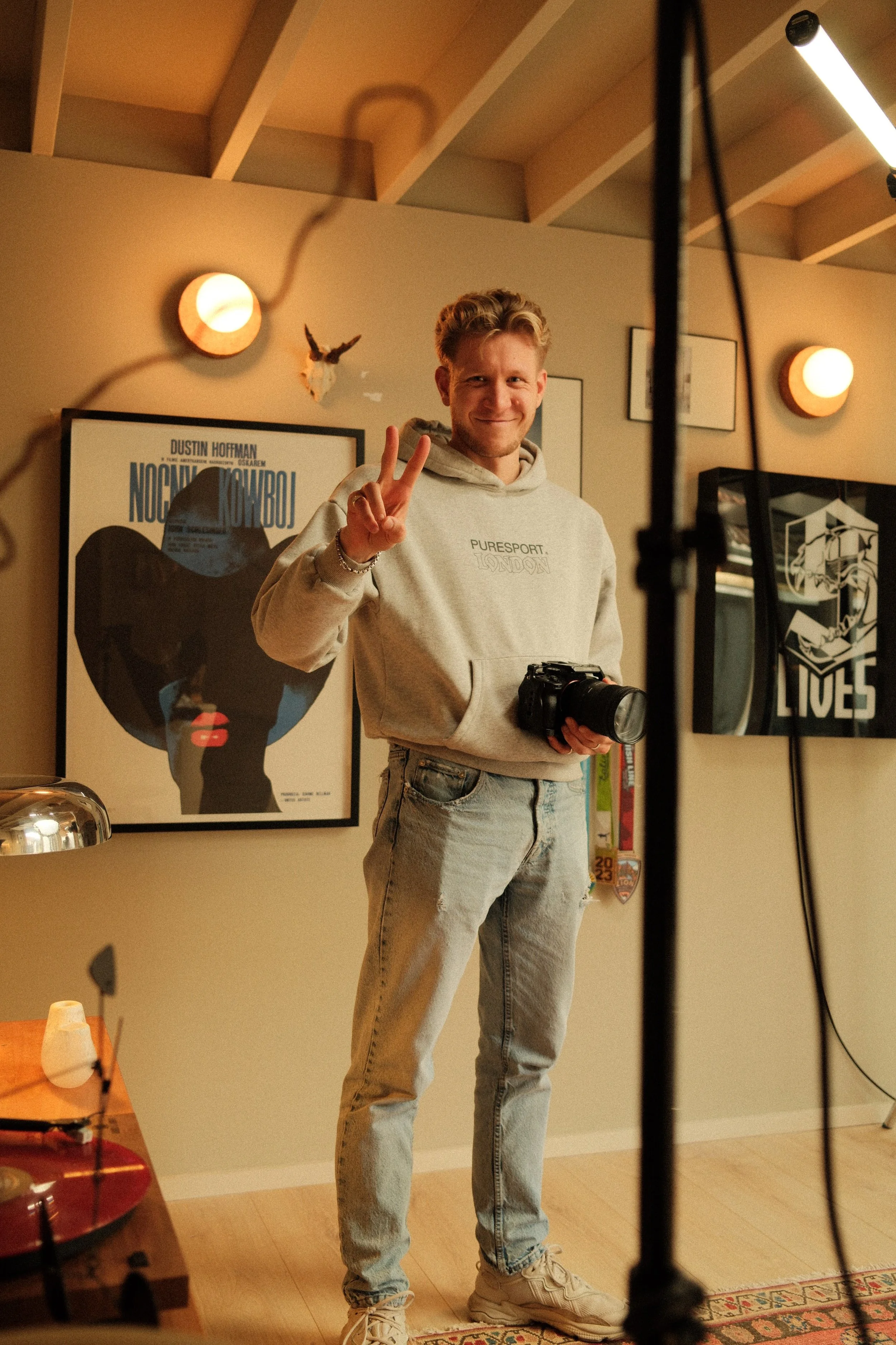 Studio Hall founder on set with camera, creating cinematic video production and photography for brands in London.