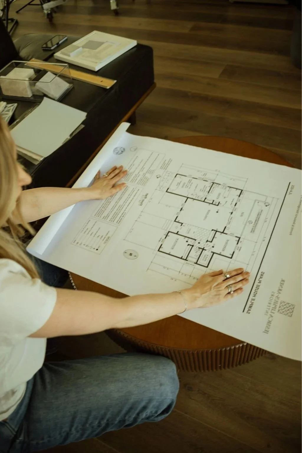 Reviewing residential design plans and project details during the interior design process.