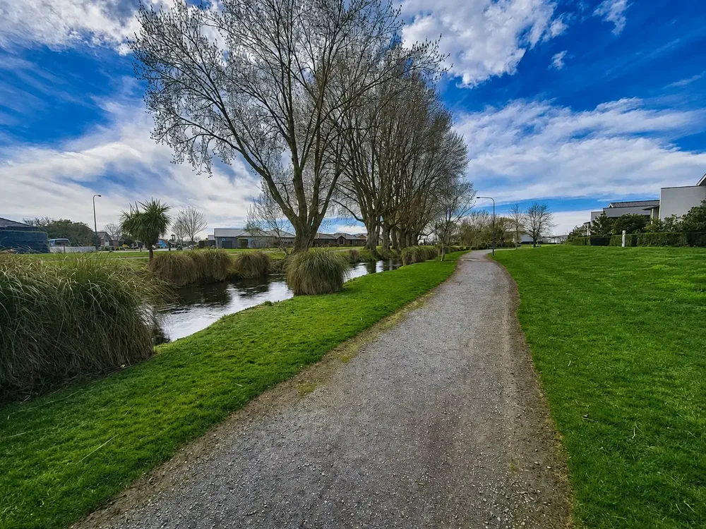 Walking track beside the landscaped Silverstream waterway near Kaiapoi