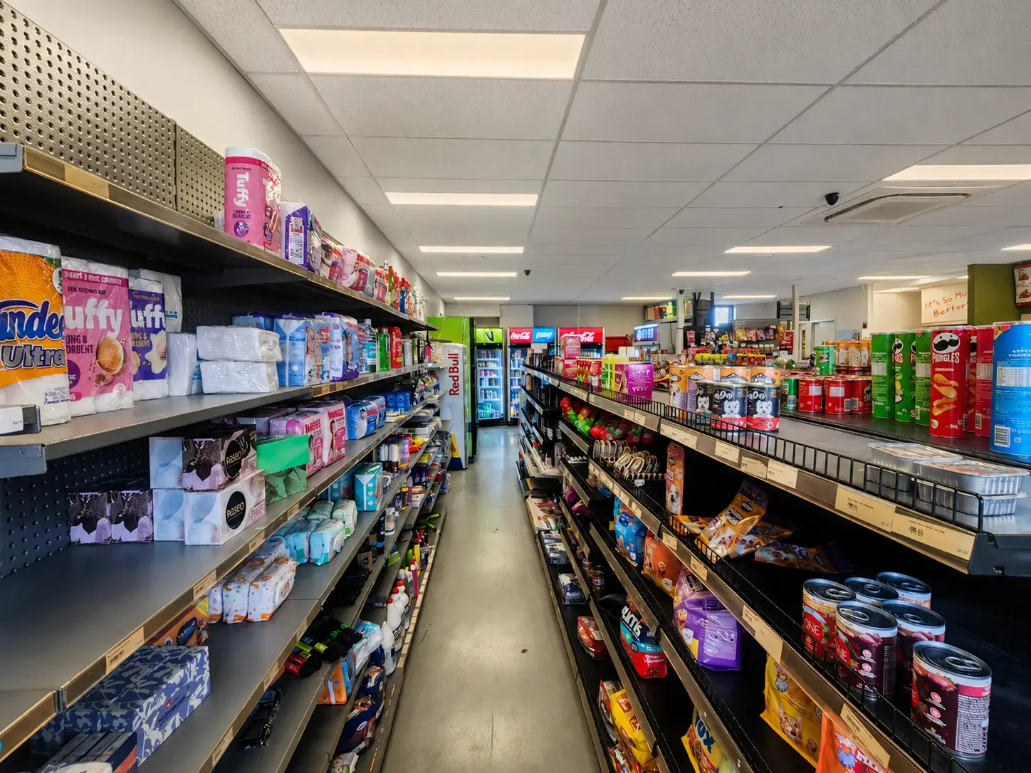 Fully stocked supermarket aisle at Naya Supermarket in Silverstream