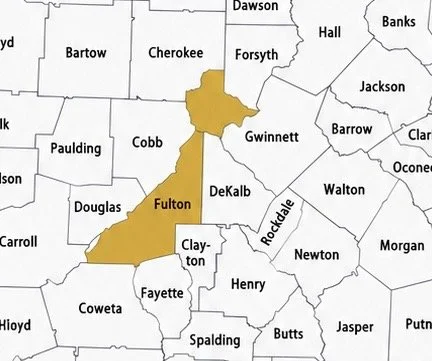 Map showing Fulton County shaded in yellow, located near Atlanta, Georgia, with surrounding counties labeled.