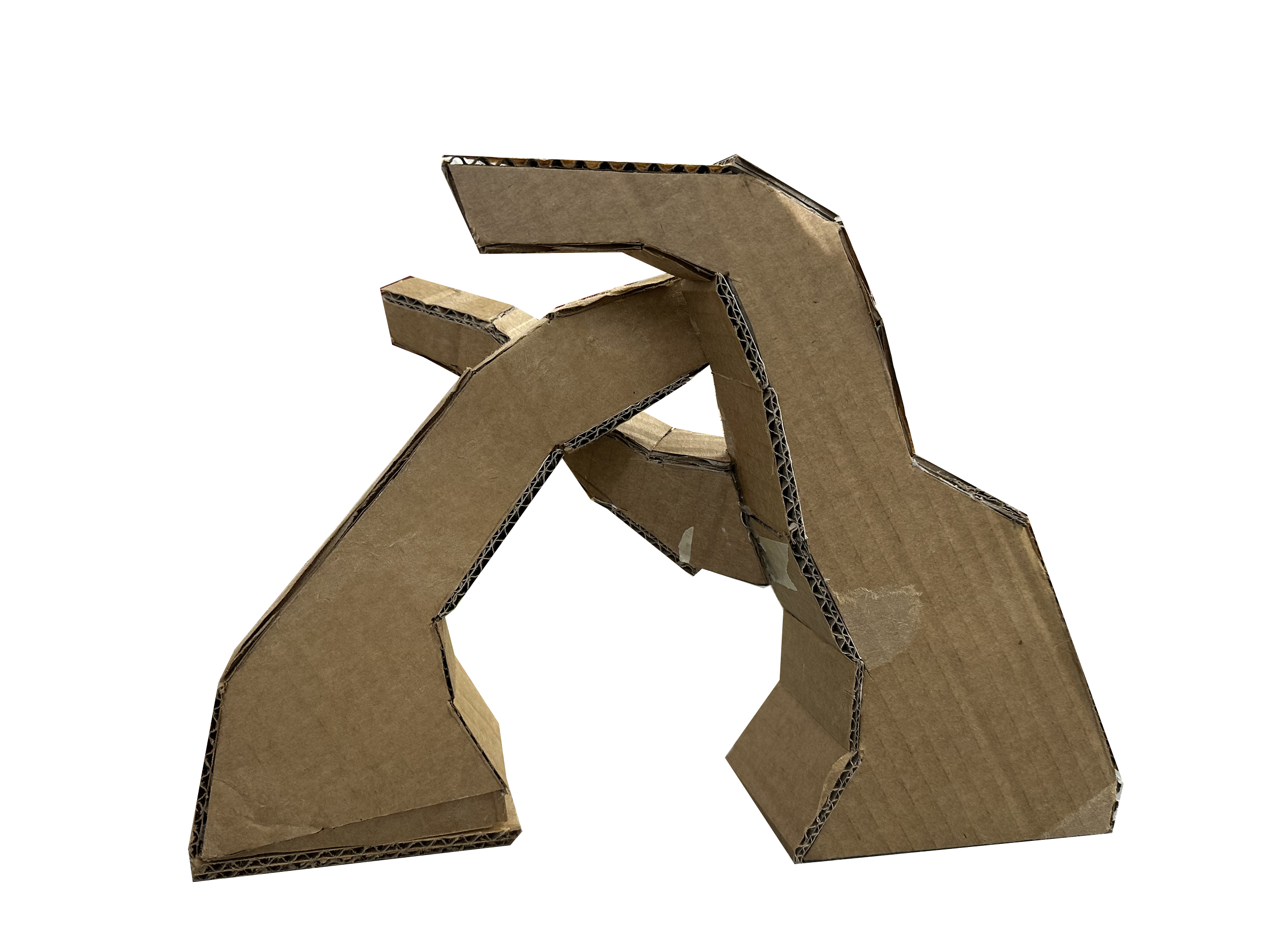 Multiple pieces of cardboard stacked and arranged to form an abstract structure or sculpture against a black background.