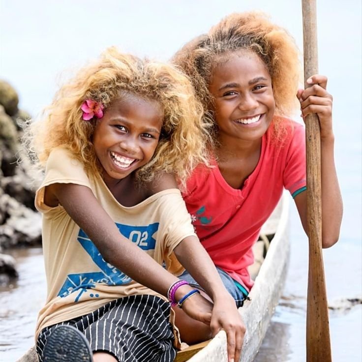 Two smiling Melanesian girls