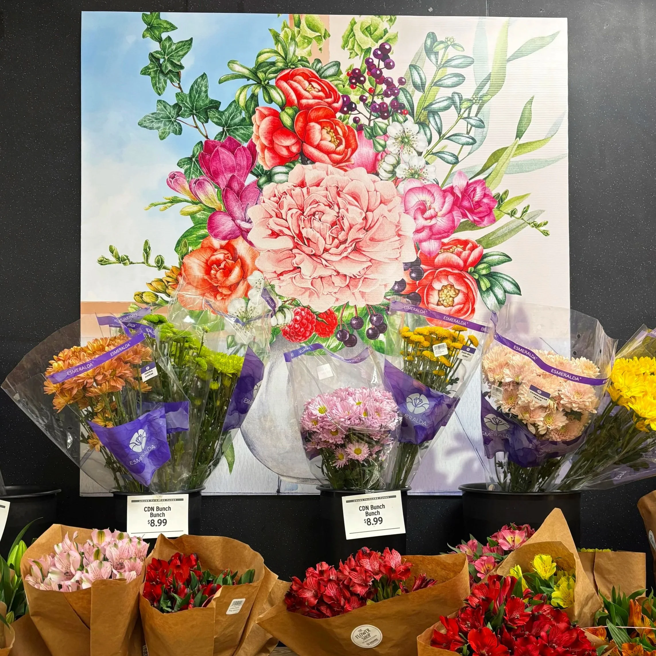 Large-format signage installed in an Adams floral department