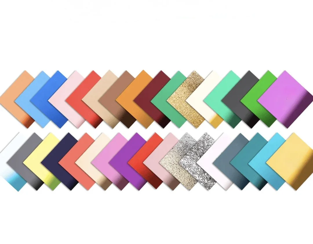A variety of colorful, textured, and glittery paper sheets arranged in two rows on a white background.