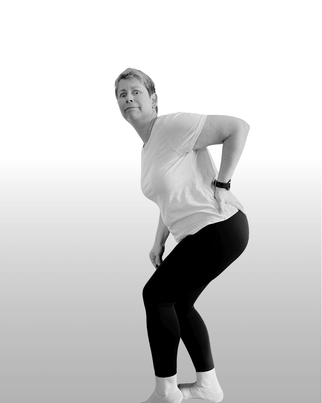 EP Rachel, bending over with her hand on her back and pained look on her face.