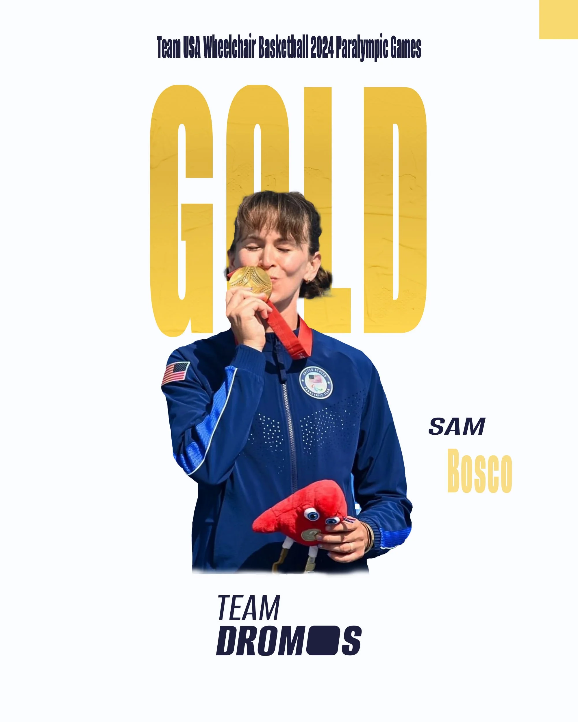A woman in a blue USA space shuttle jacket holding a red puppet with big eyes and a dressed-up face, with medals and a ribbon around her neck, smiling and kissing a gold medal.