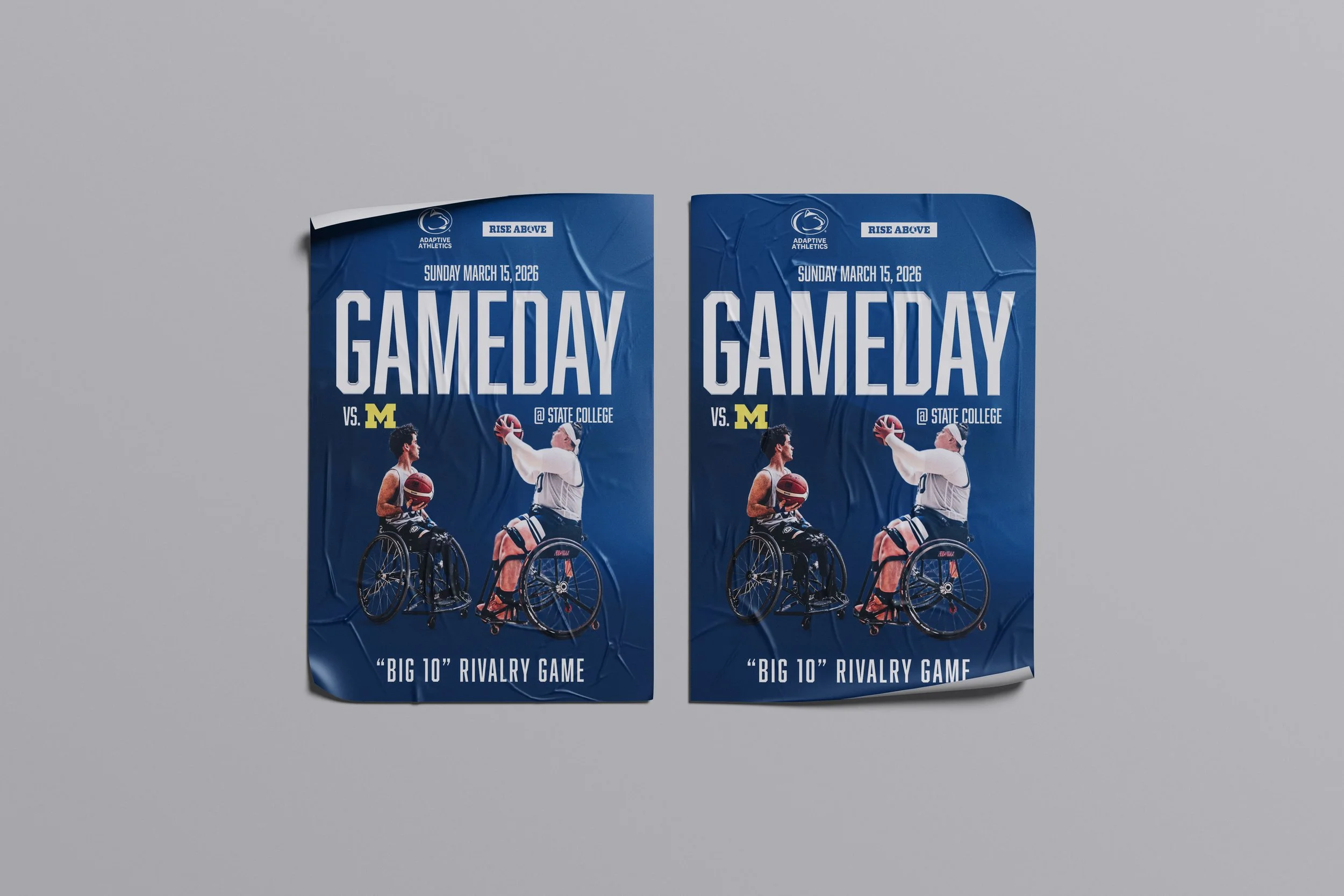 Two posters advertising a basketball game between teams from Michigan State University and the University of Michigan, scheduled for Sunday, March 15, 2026, at State College. The posters feature images of two men, one in a wheelchair holding a basketball and the other wearing a basketball uniform, both appearing to compete for the ball.