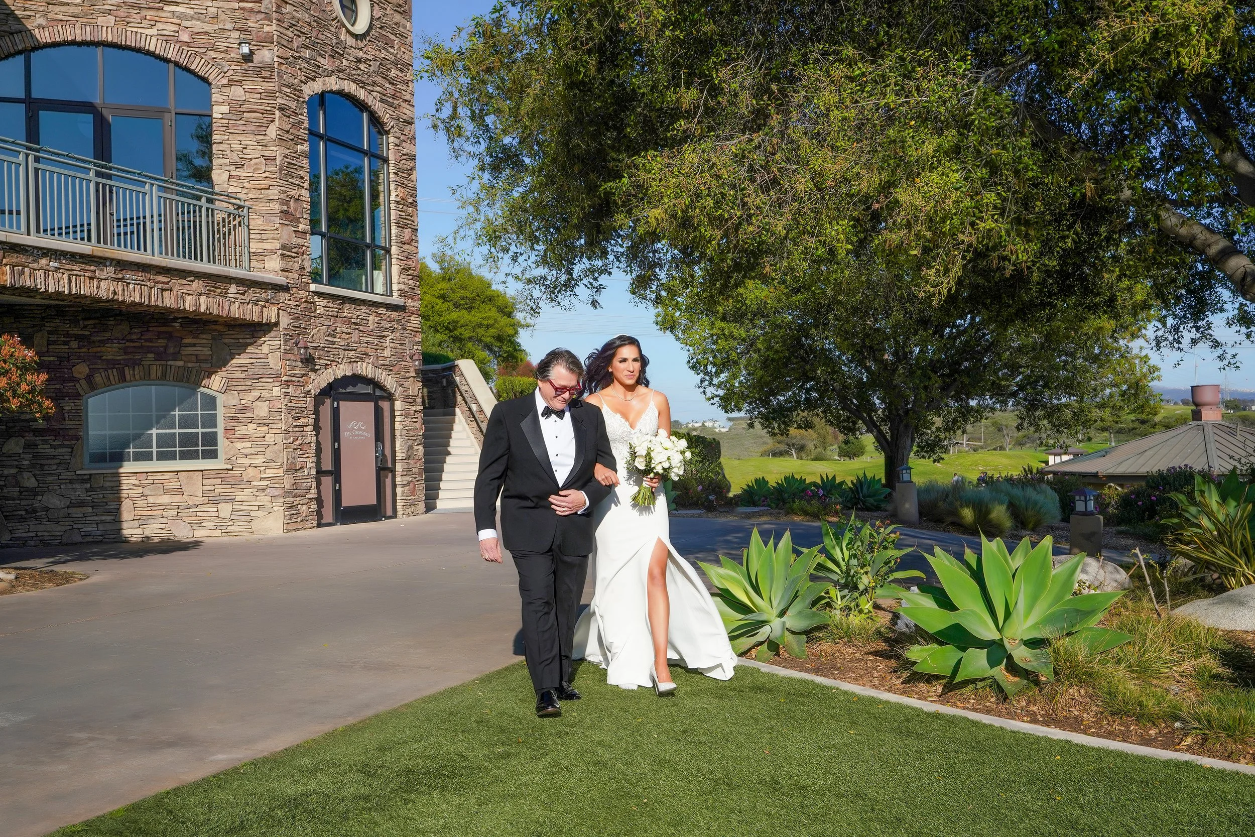 father-walking-bride-down-aisle-outdoor-ceremony.jpg