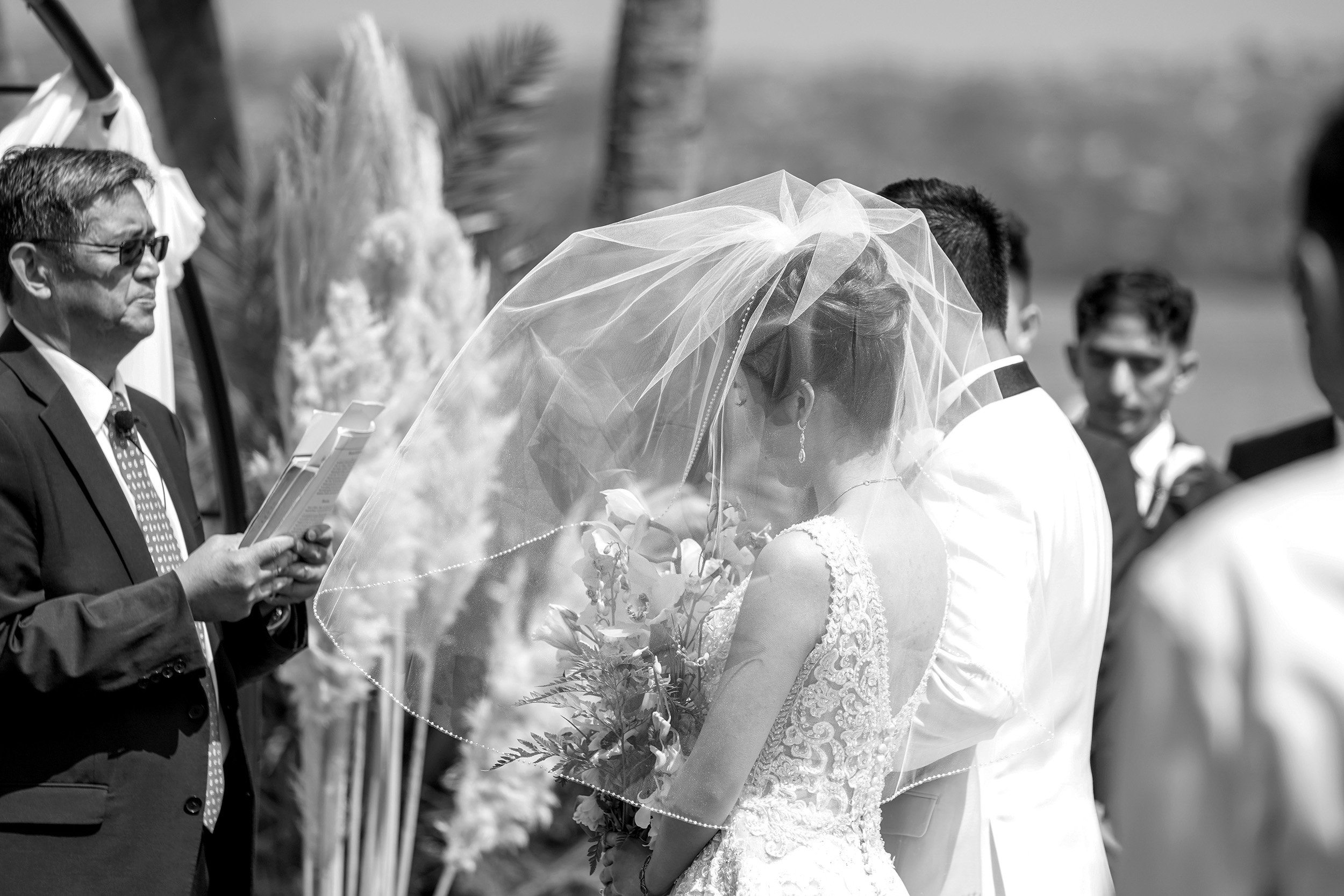 bride-wearing-blusher-veil-wedding-ceremony.jpg