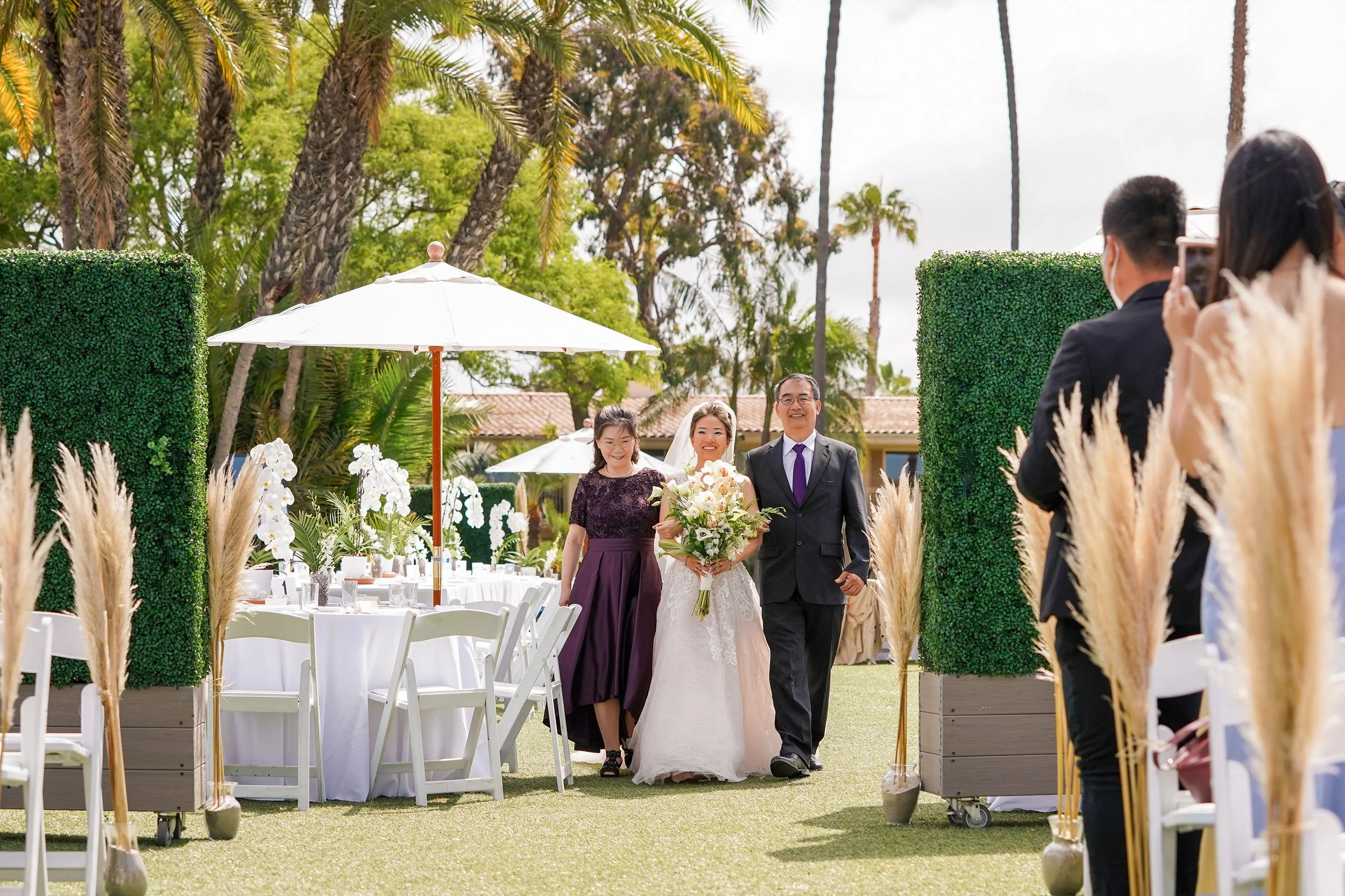 bride-walking-down-aisle-with-parents.jpg
