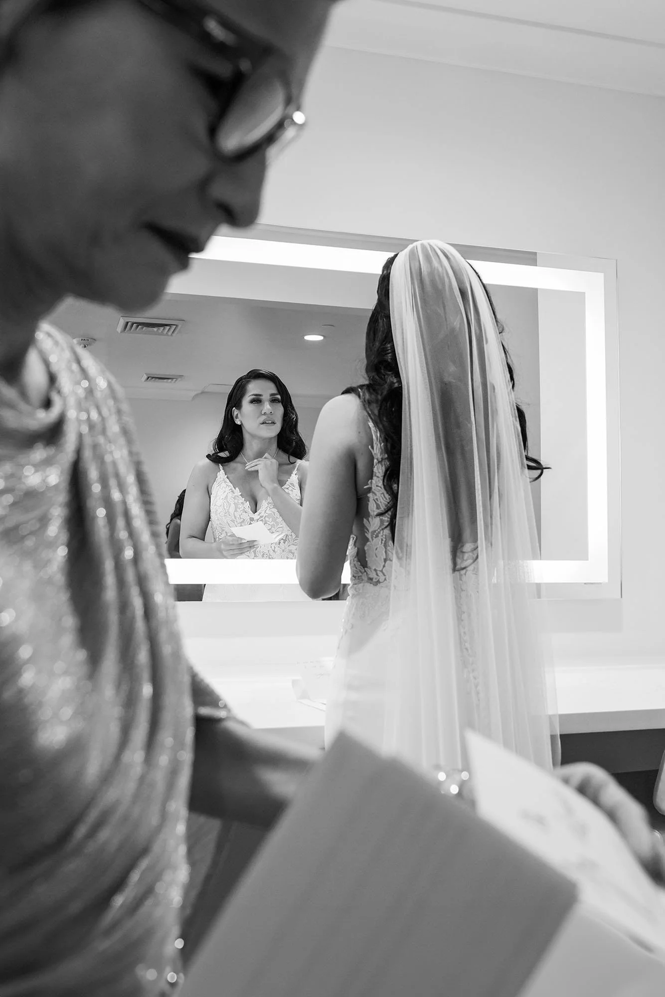 bride-reading-vows-mirror-reflection-black-and-white.jpg