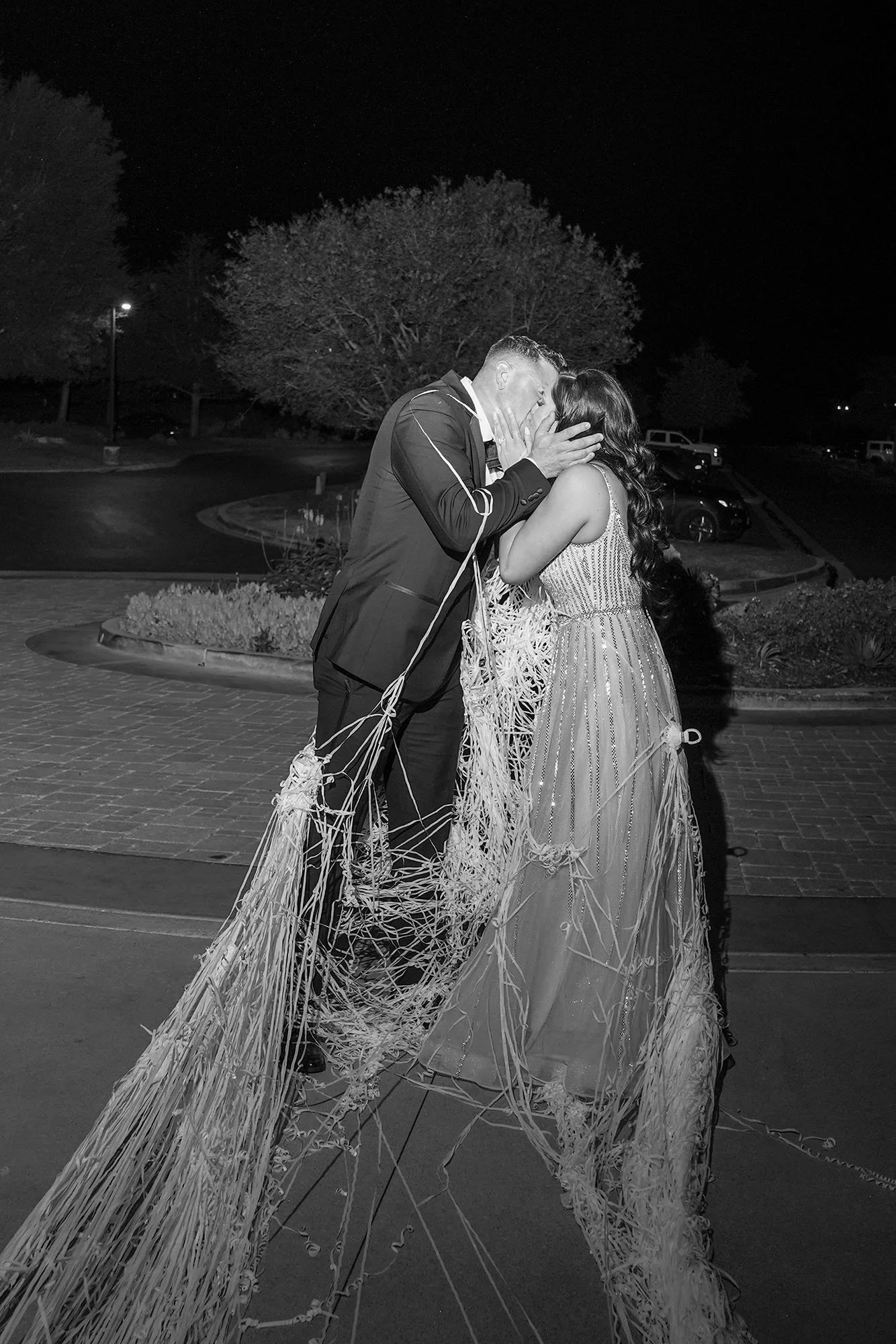 black-and-white-wedding-exit-kiss.jpg