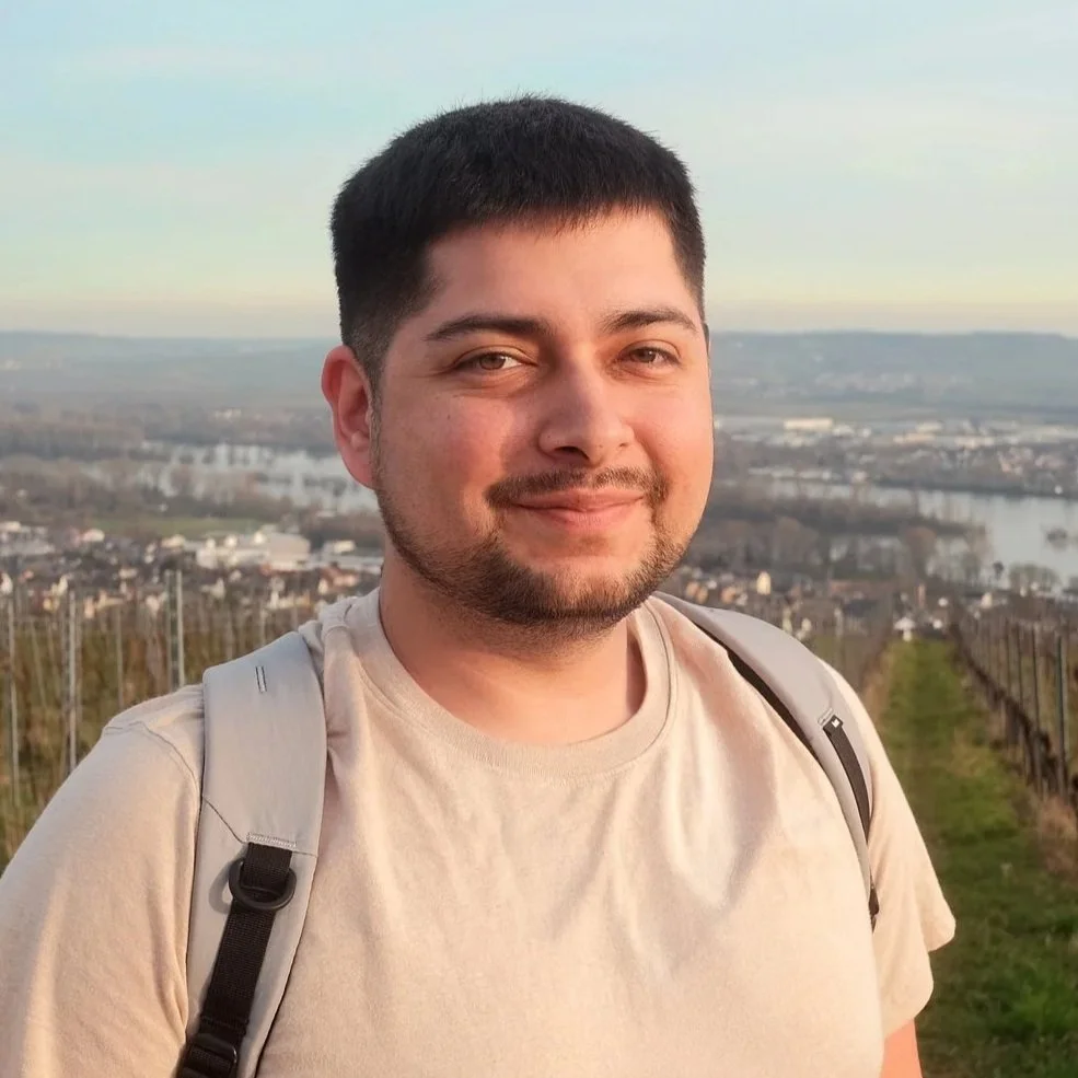 David N. Garcia, professional photographer and visual storyteller, standing in a scenic vineyard overlooking the Rhine Valley in Germany.