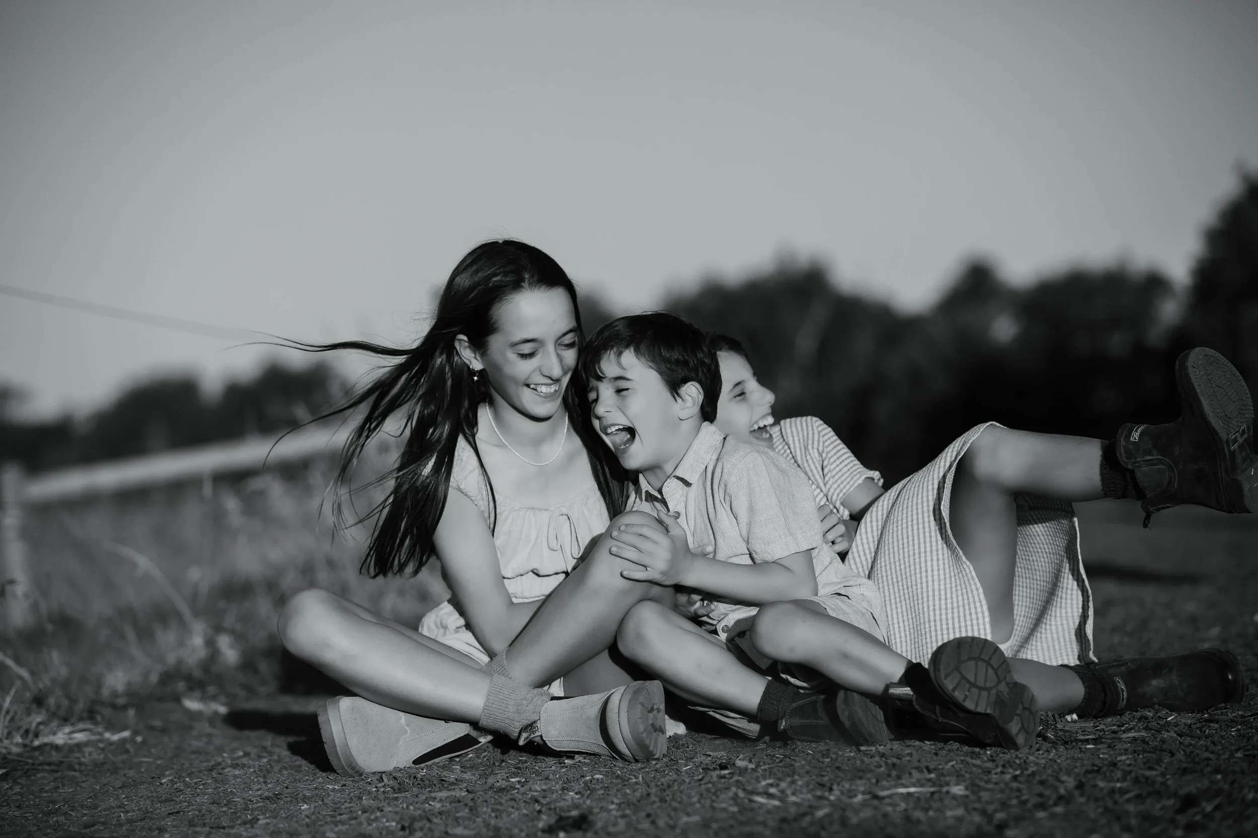 ©Vicky-Hughson-Photography-Family-Laughing-Farm-BW.webp