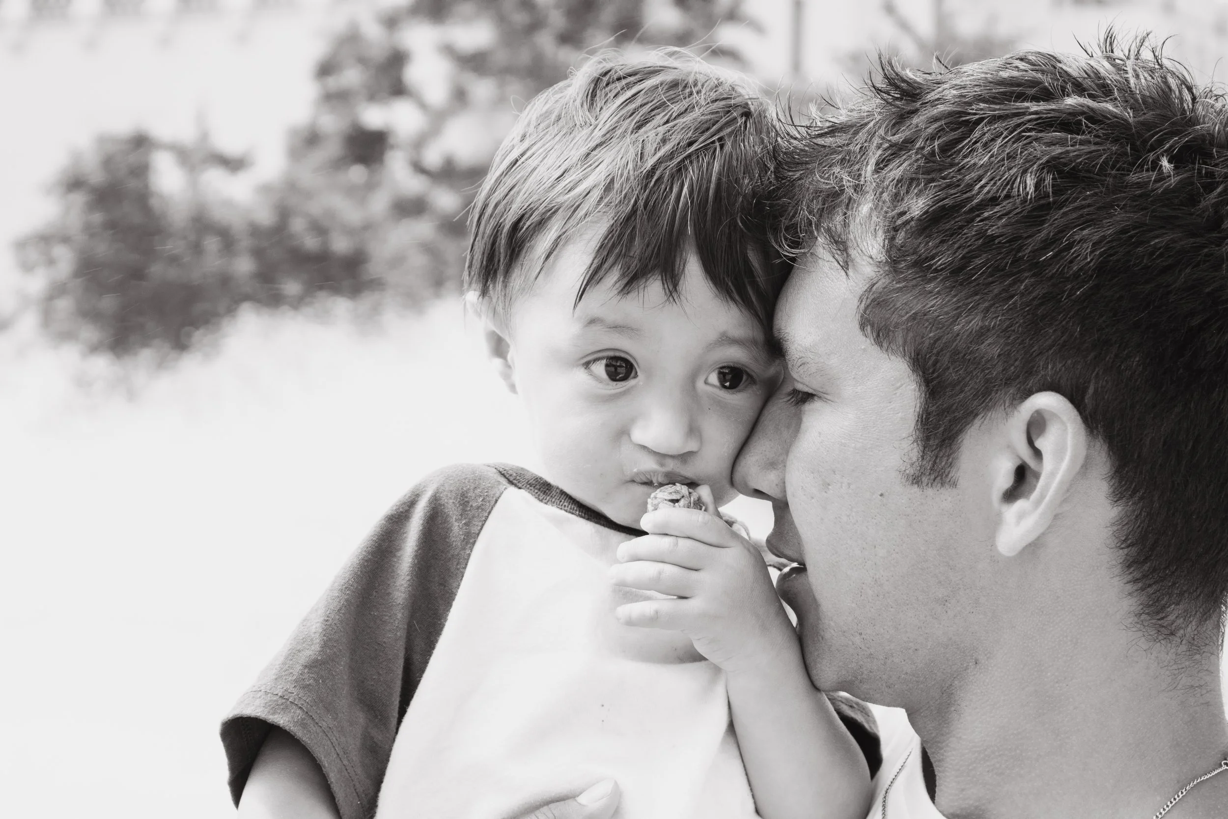 Candid Black and White Father Son Portrait