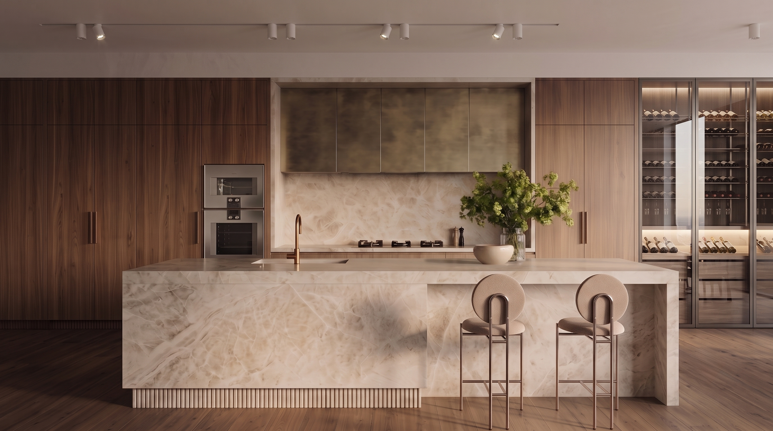 a moody elevated kitchen with marble island, wooden cabinets, a built-in oven, a gas cooktop, a faucet, a vase with green flowers, and a wine fridge.