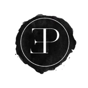 A black ink splash with a white circle and a stylized letter E inside the circle.