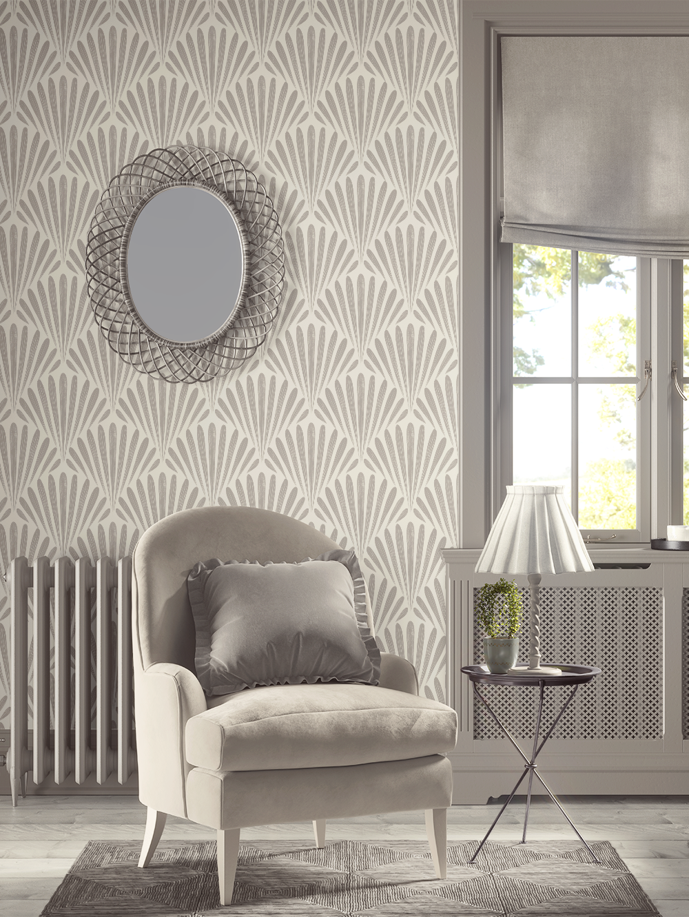 A cozy room corner with a taupe armchair and dark pillow, floral-patterned wallpaper, a round mirror with a woven frame on the wall, a window with a roller shade, a side table with a white lamp and a potted plant, and a radiator.