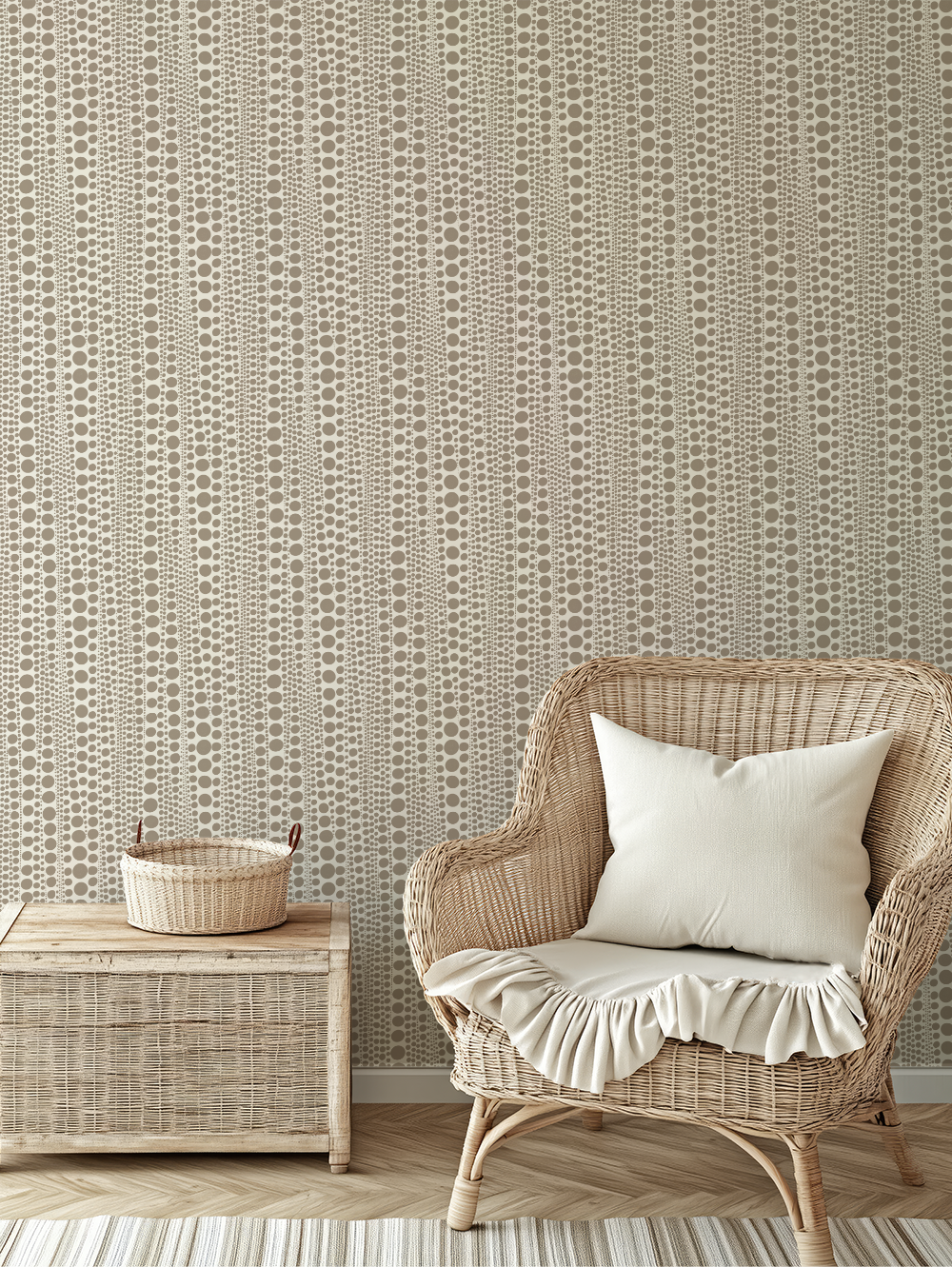 Wicker armchair with white cushion and ruffled seat cover next to a wooden side table with a woven basket, against a patterned beige and taupe wallpapered wall.
