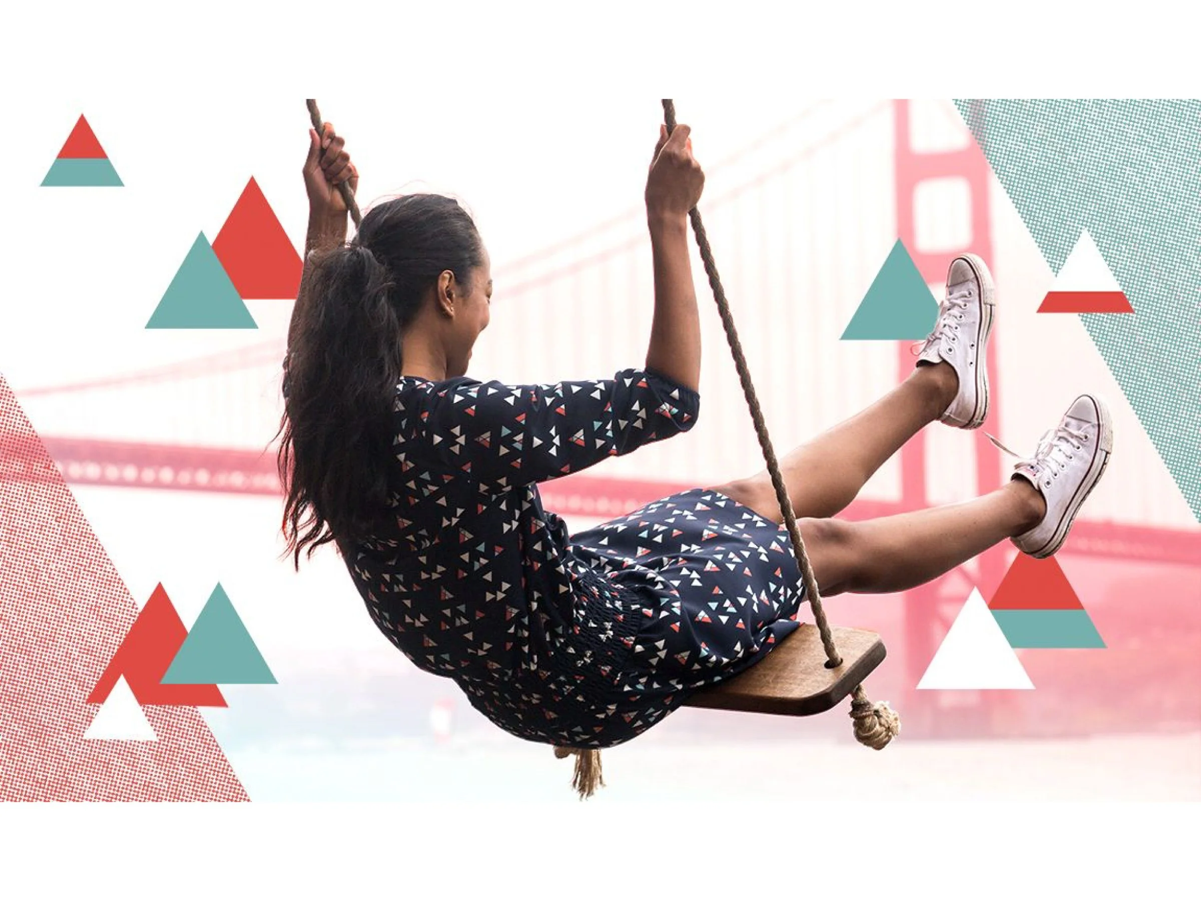 Woman with dark hair in a ponytail wearing a black dress with small triangular patterns, sitting on a wooden swing hanging from a rope, with a blurred bridge structure in the background and graphic triangle designs overlayed.