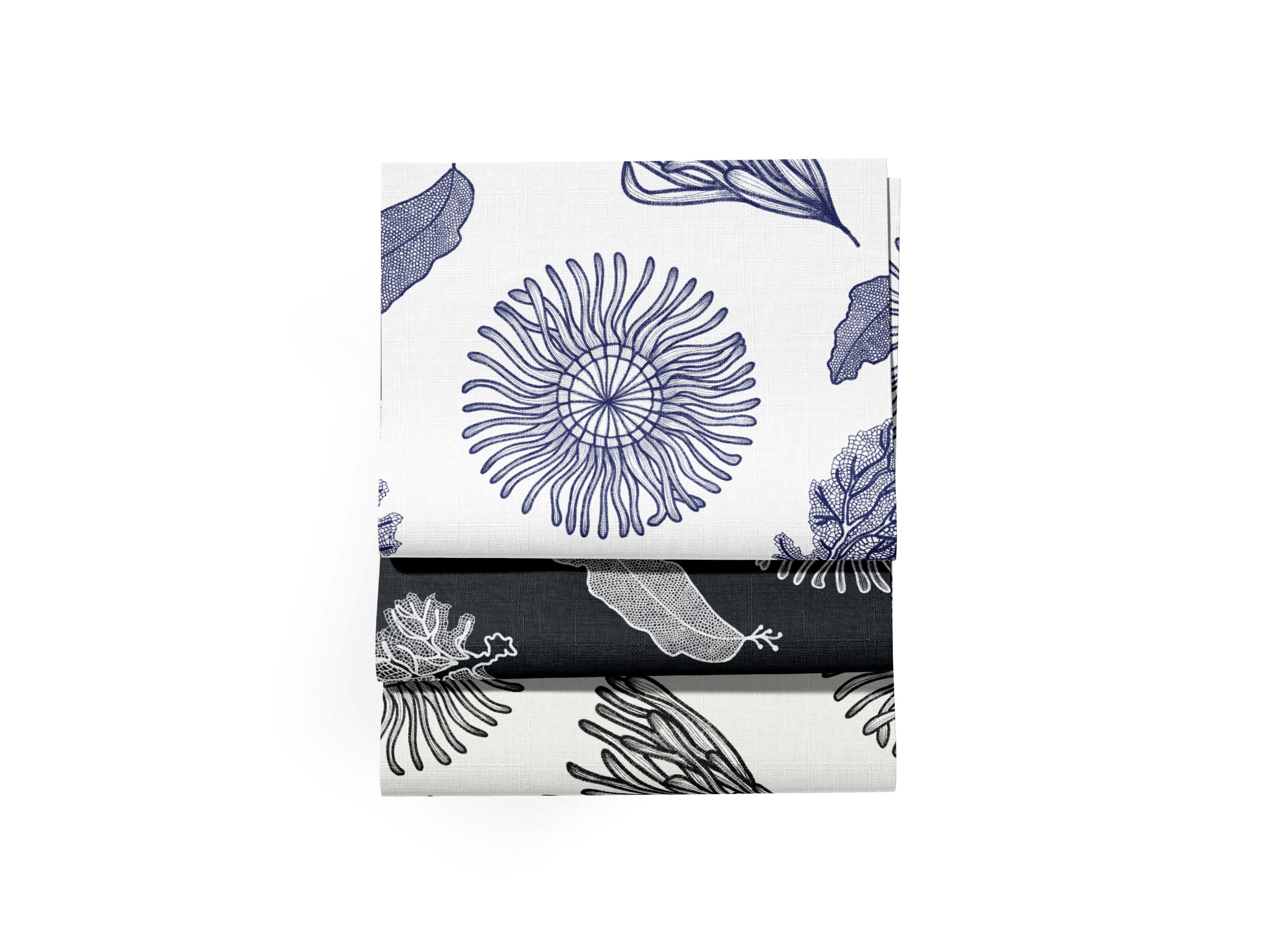 Close-up of fabric with a white background decorated with dark blue seaside botanicals.
