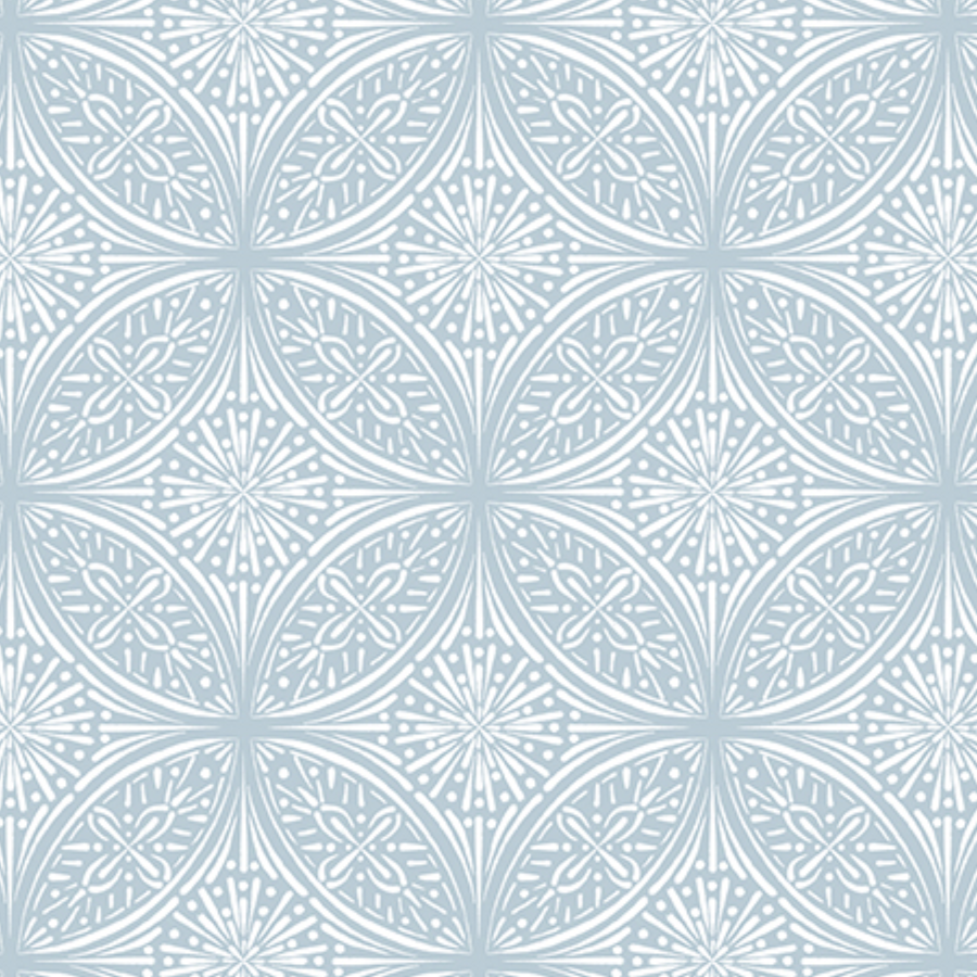 A pattern of intricate white designs resembling floral or starburst shapes on a light blue background.