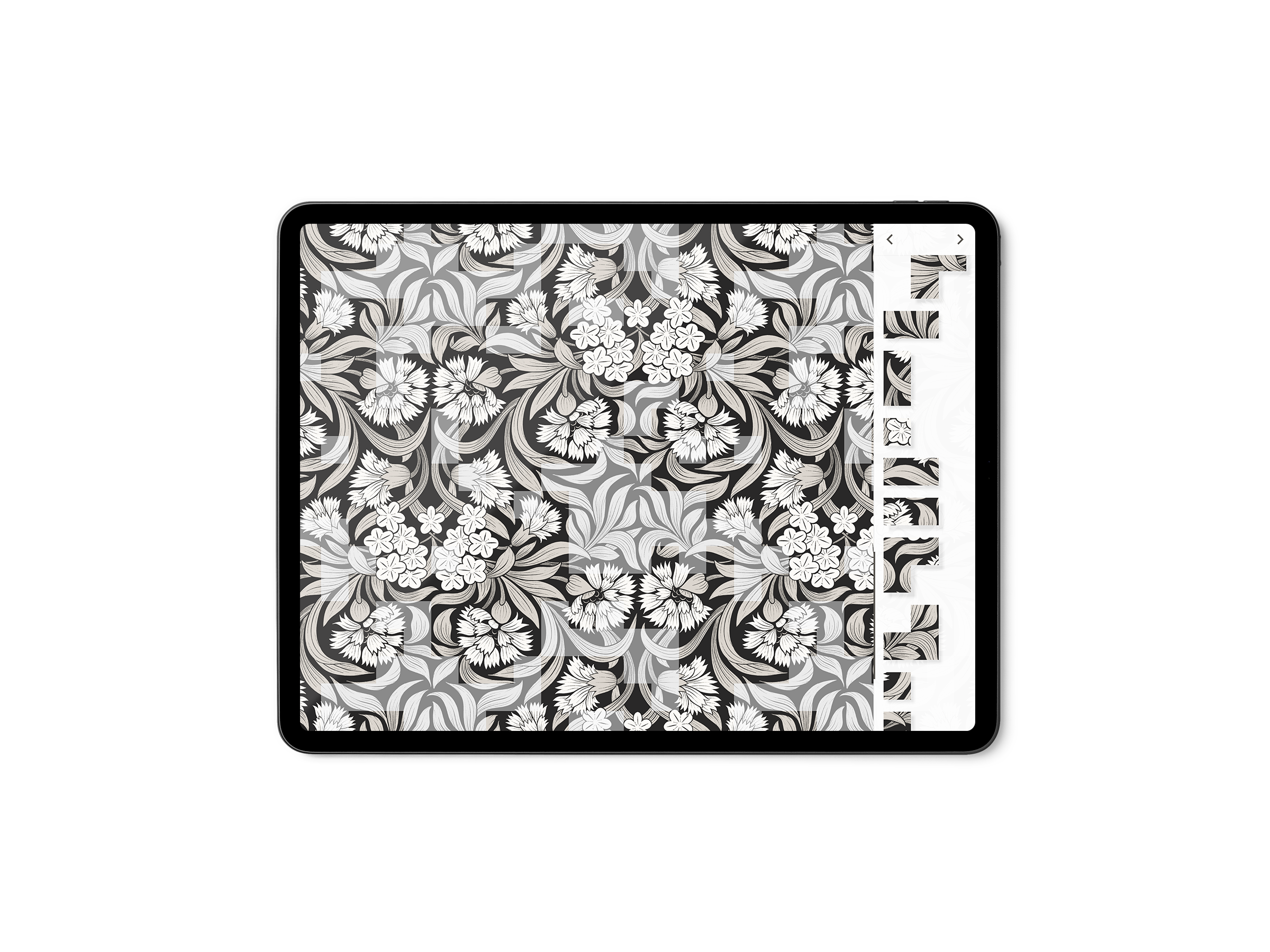 Close-up of a digital device screen displaying a black and white floral pattern, with side tabs showing various puzzle piece shapes..