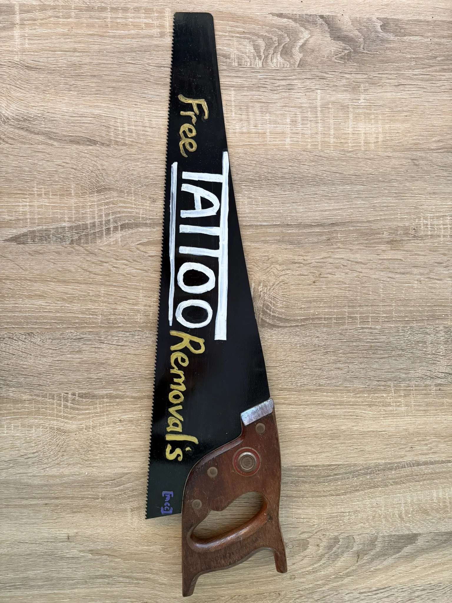 Painted Free Tattoo Removals Hand Saw
