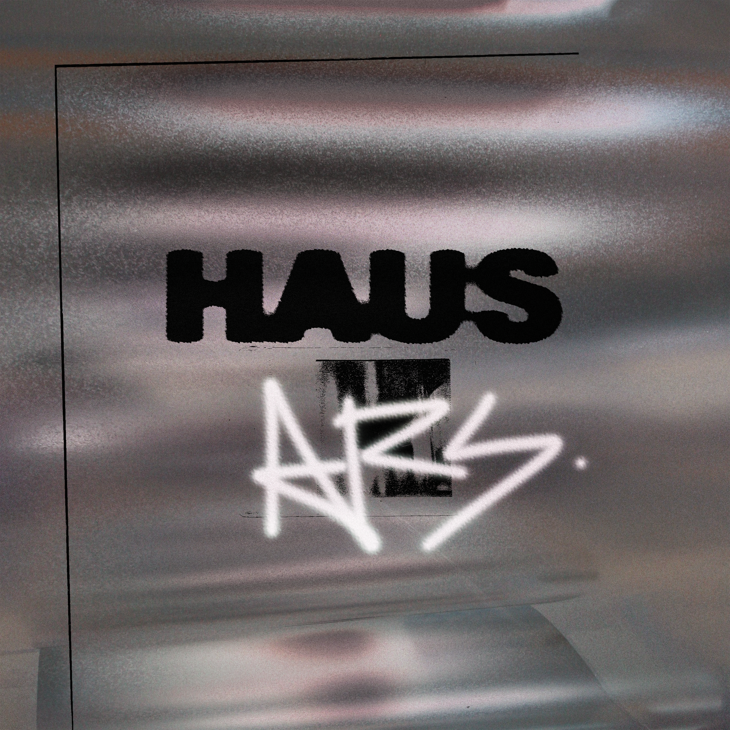 Close-up of a metallic surface with partially visible text and shadows