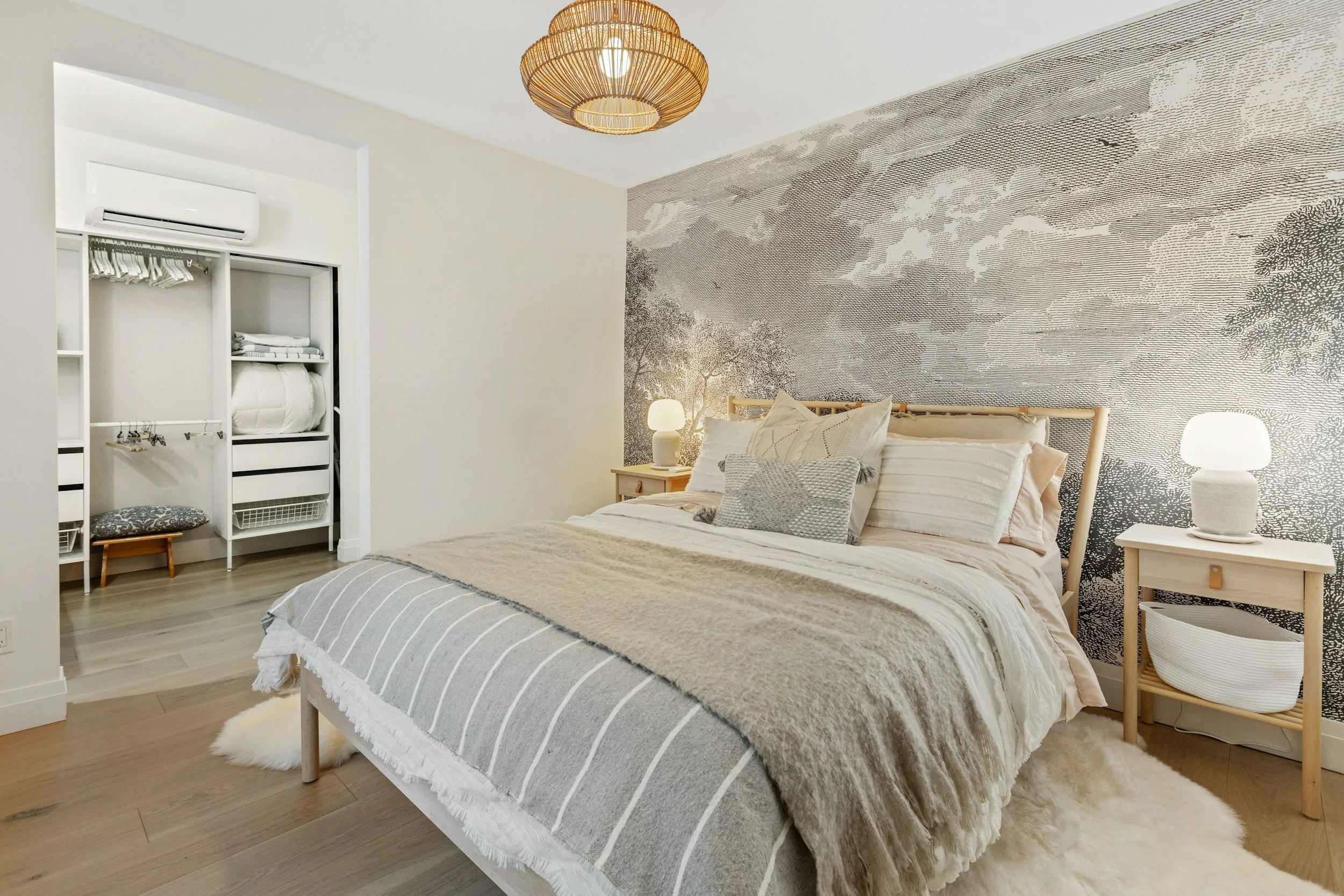 Wallpaper feature wall in a finished bedroom by Takumi Decorative Finishes