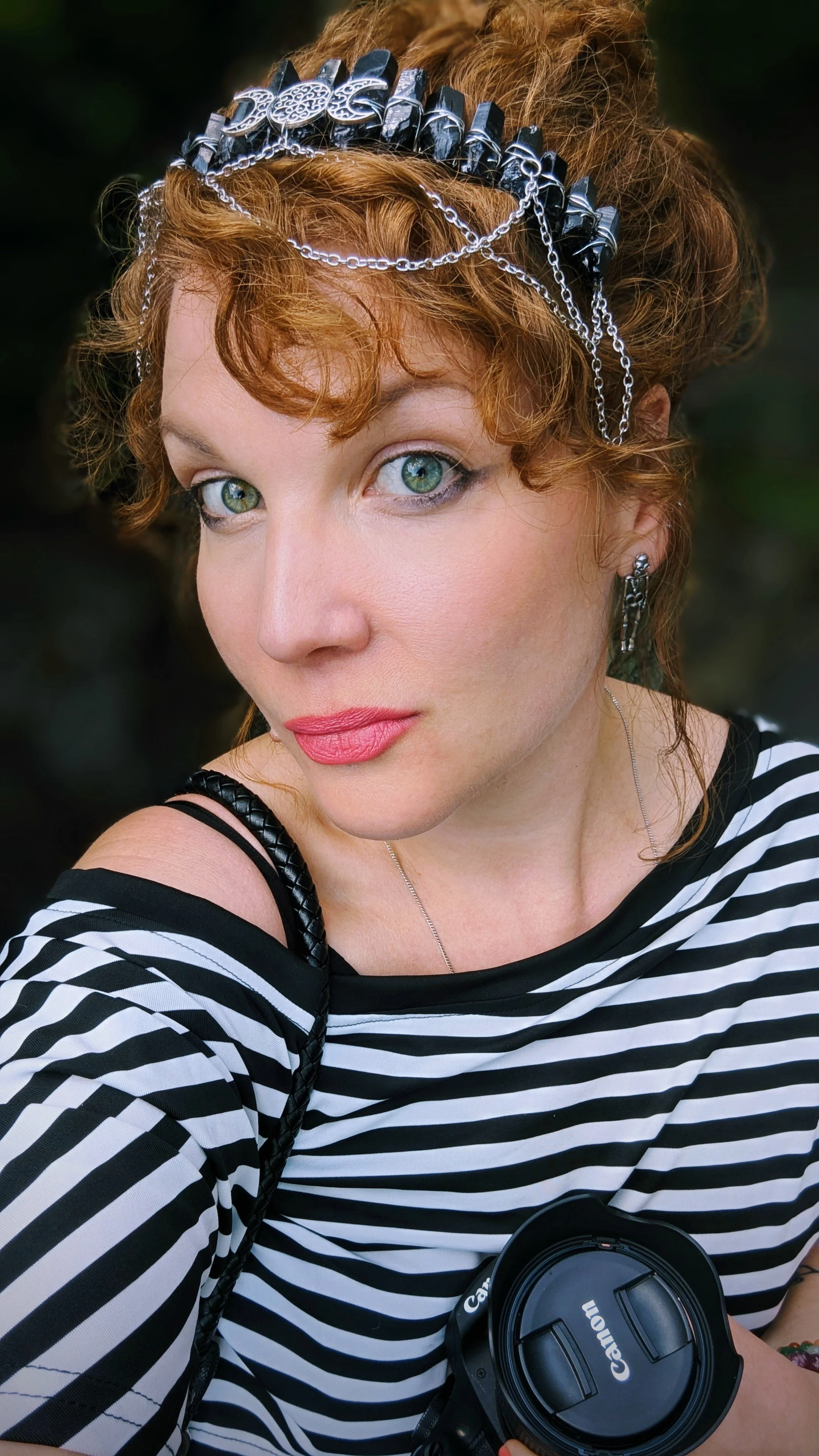 portrait of woman with camera