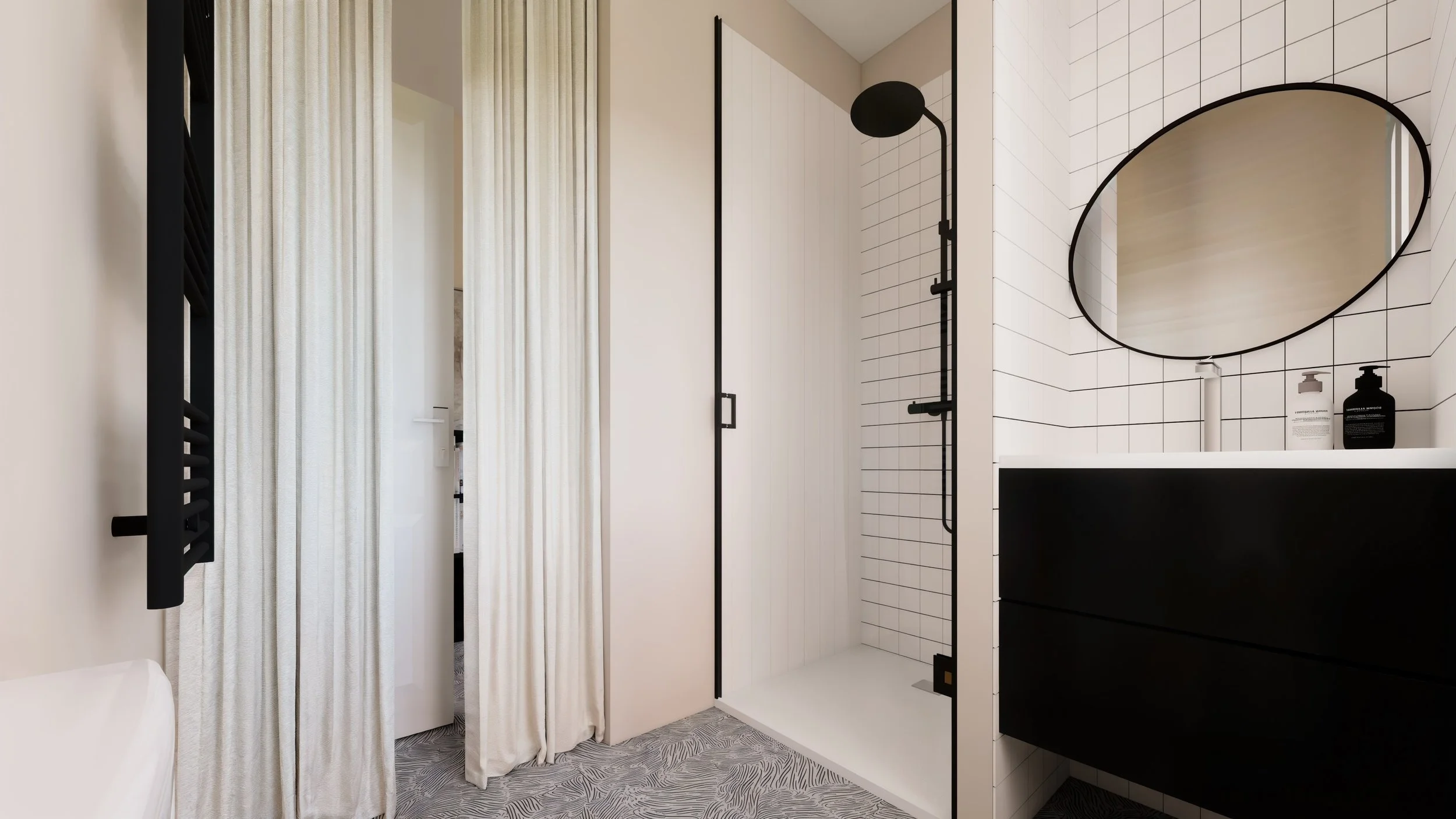Salle de bain moderne avec une douche séparée, miroir rond, lavabo blanc, et éléments noirs, avec des rideaux blancs et un tapis gris à motifs.