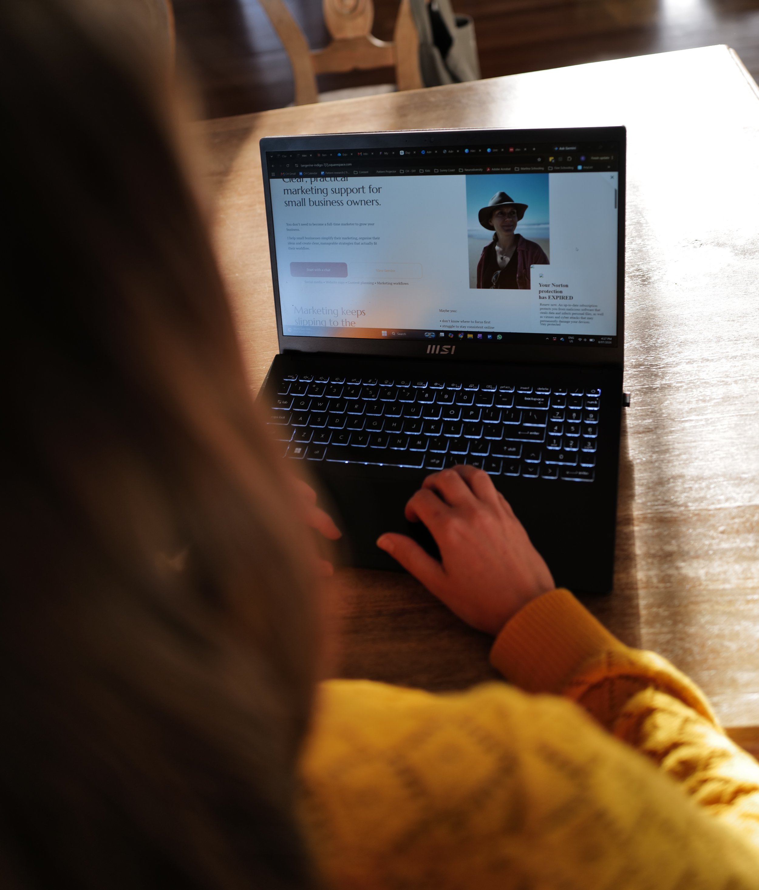 Small business marketing website displayed on a laptop during a marketing planning session.