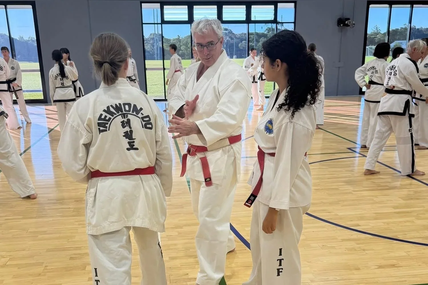 Ross Cameron coaching martial arts students during a practical seminar session.